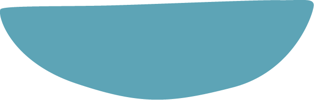 A scoop of light blue ice cream in a bowl with a spoon.