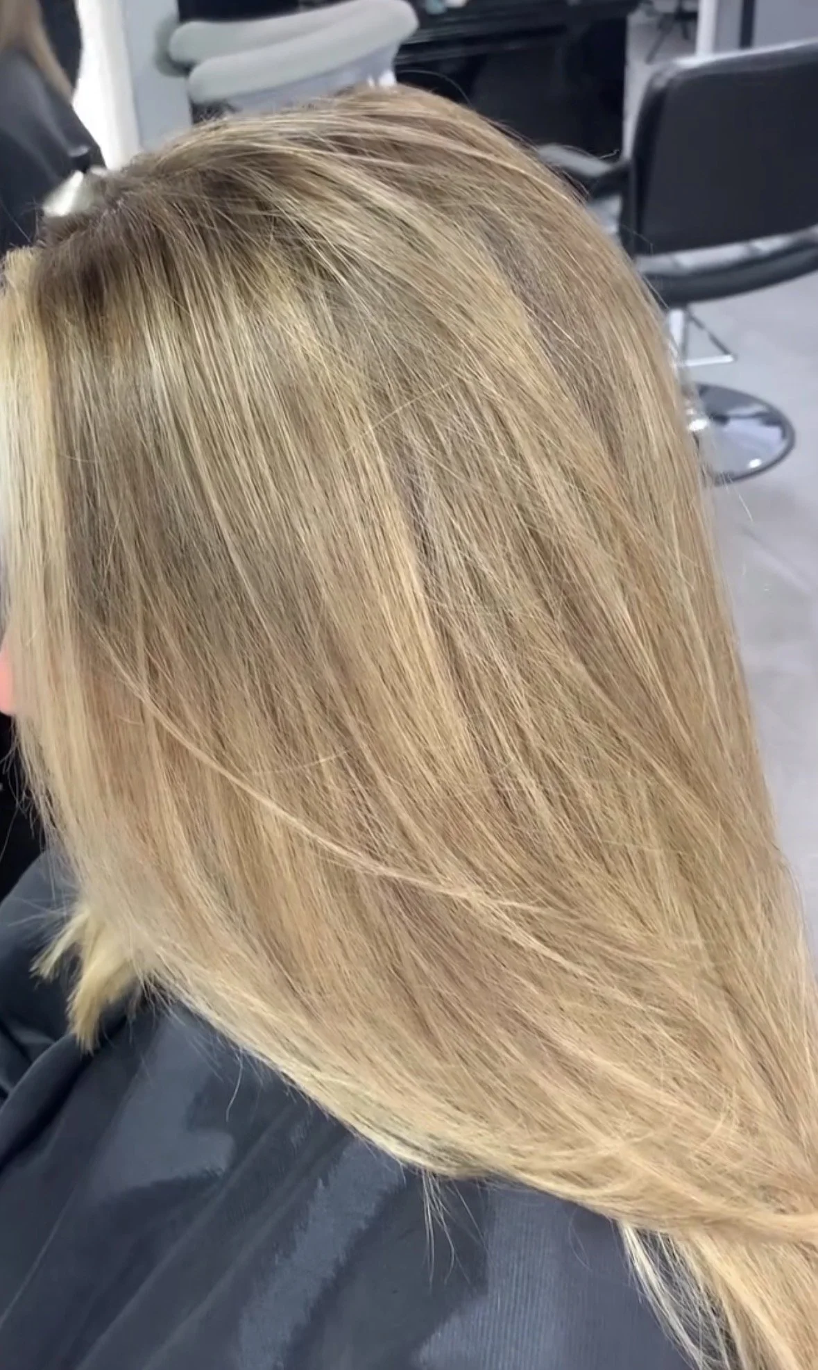 Closer view of freshly styled blonde hair at a hair salon.