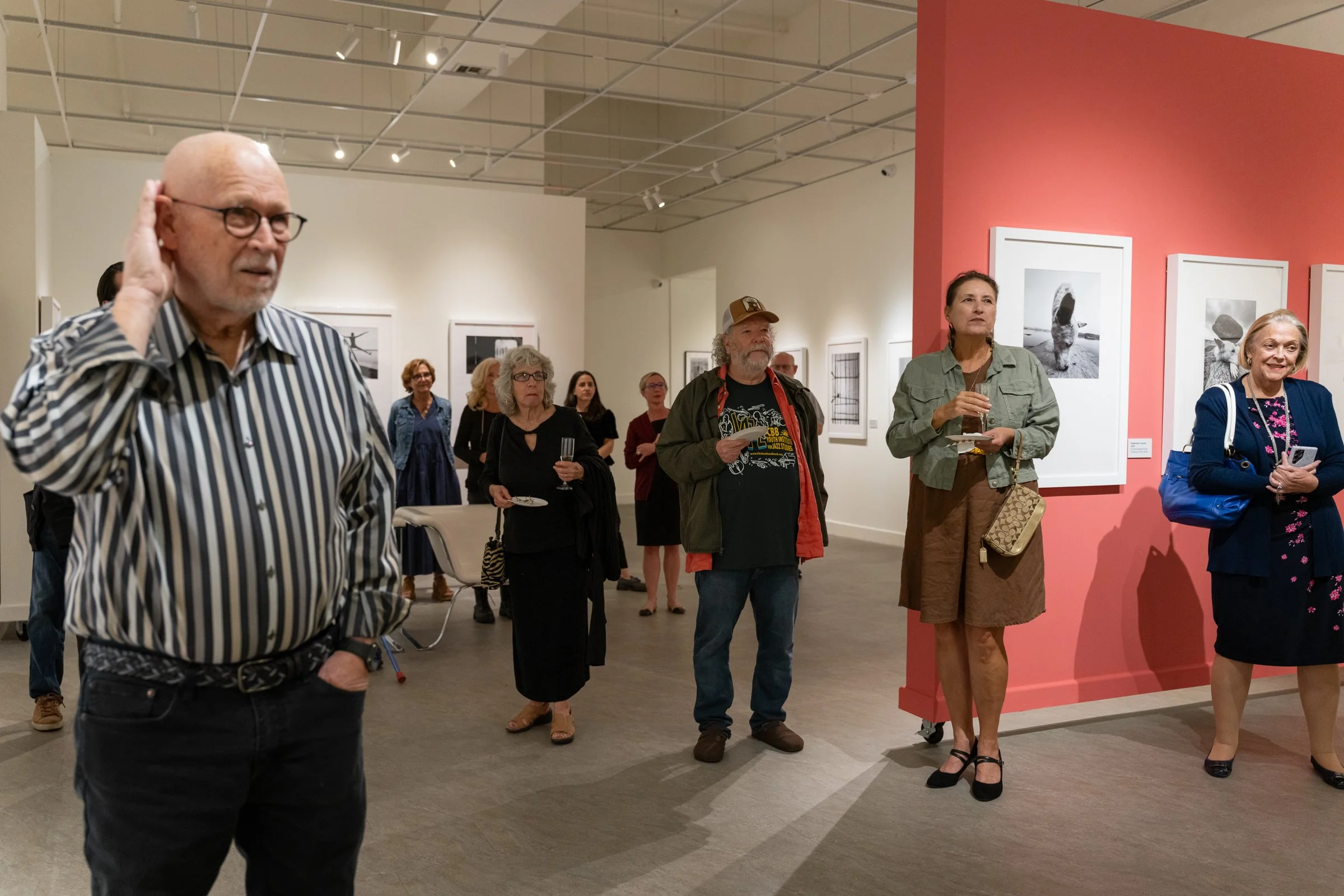 Exhibition visitors experiencing Dimpy Bhalotia’s mobile photography exhibition at the Florida Museum of Photographic Arts.