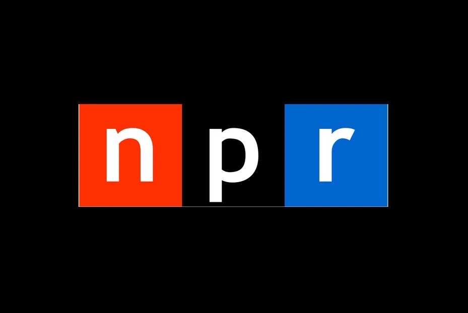 NPR logo with black background, red and blue squares behind the lowercase 'n' and 'r', white lowercase 'p' in the center.