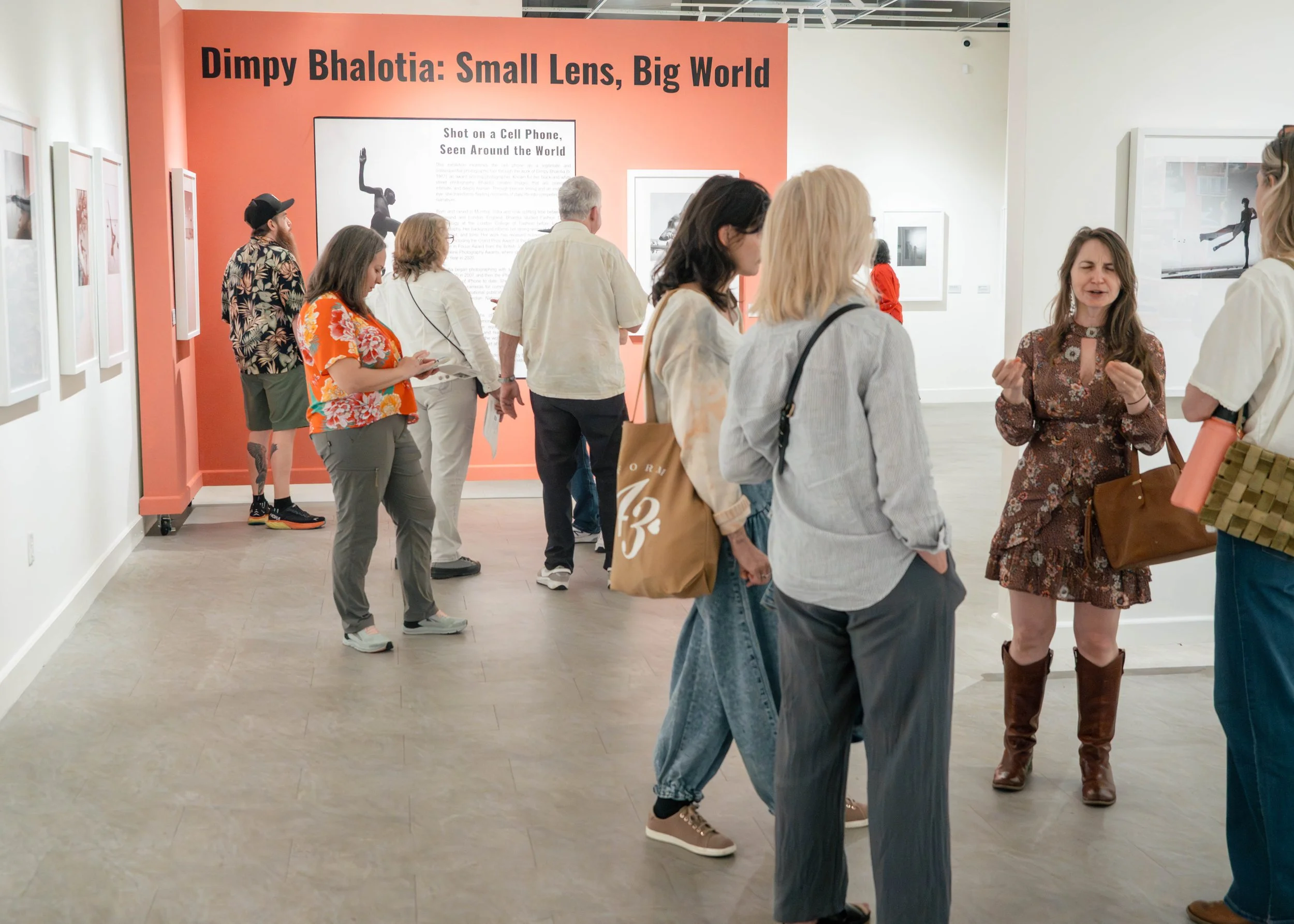 Visitors viewing photographs at Dimpy Bhalotia’s solo exhibition at the Florida Museum of Photographic Arts (FMoPA), Florida, USA.