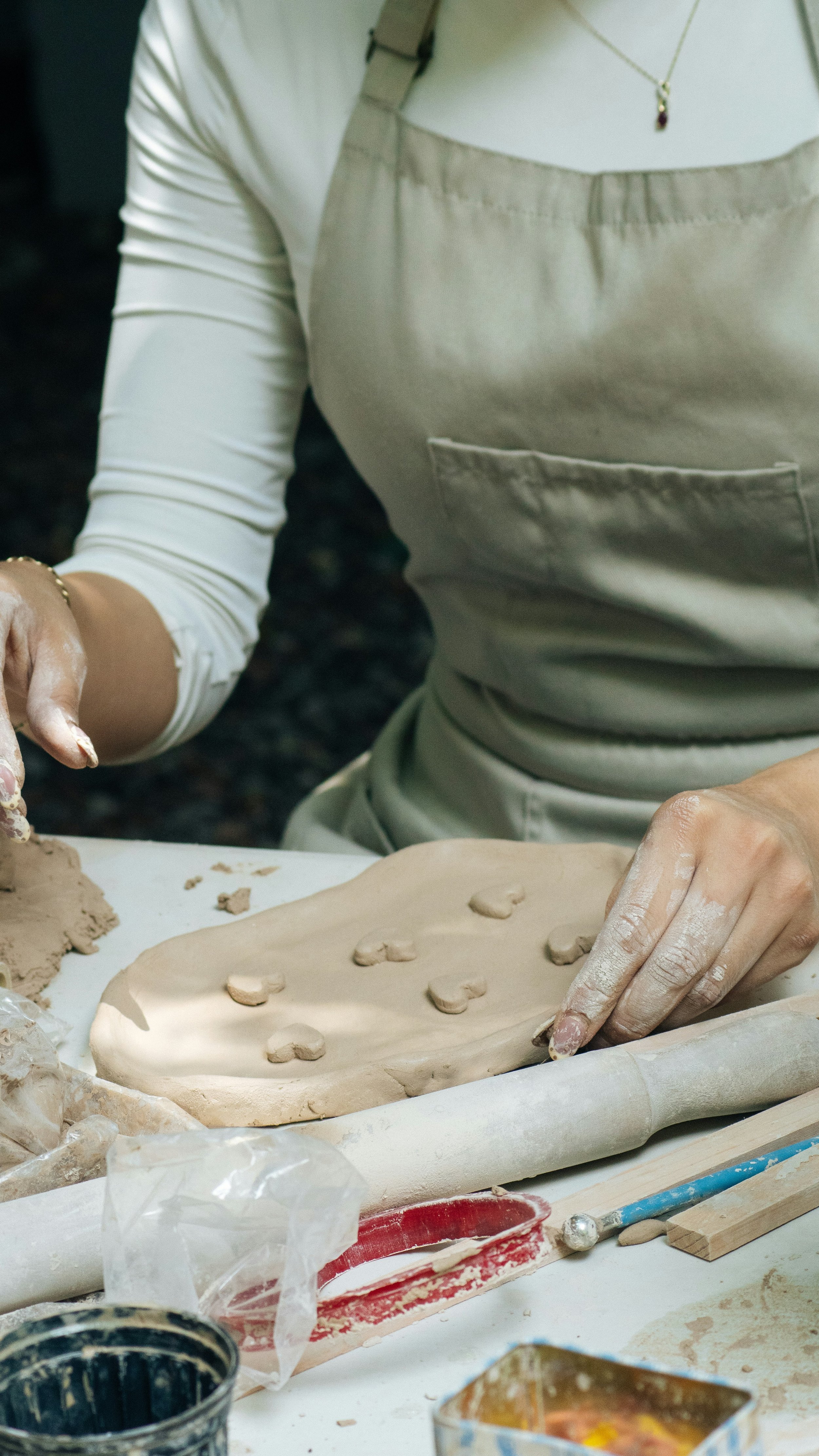 Photo by Sebastian Monroy on Unspash. Handmaking clay crafts.