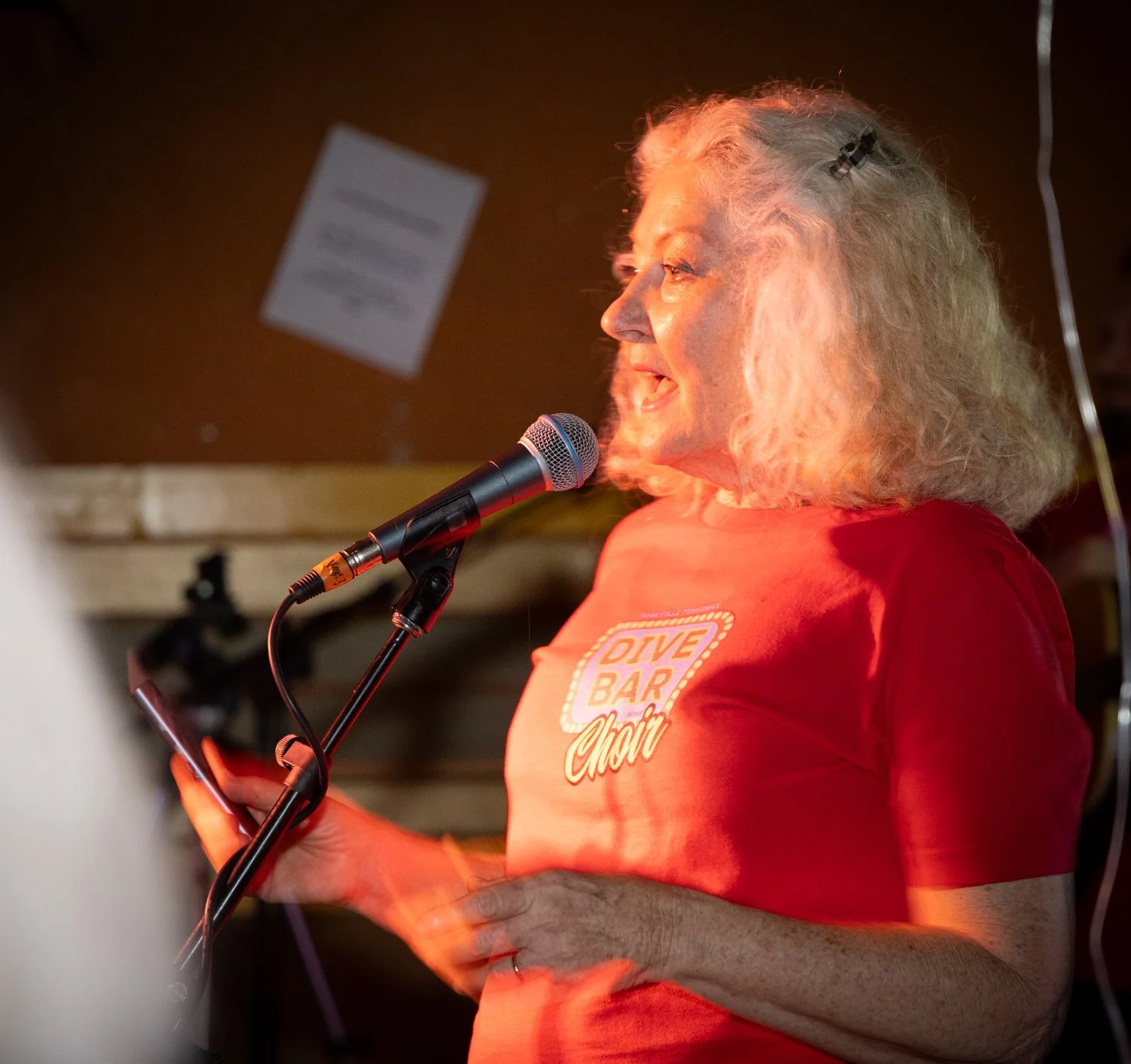 Zelda on stage at our Dive Bar Choir Launch Party,