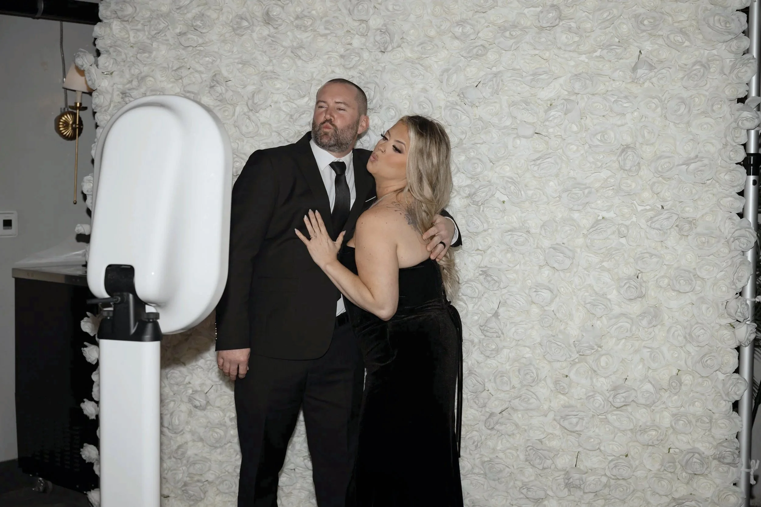 Wedding guests posing together at the Modern Booth during a Savannah wedding reception, capturing fun digital memories to share instantly