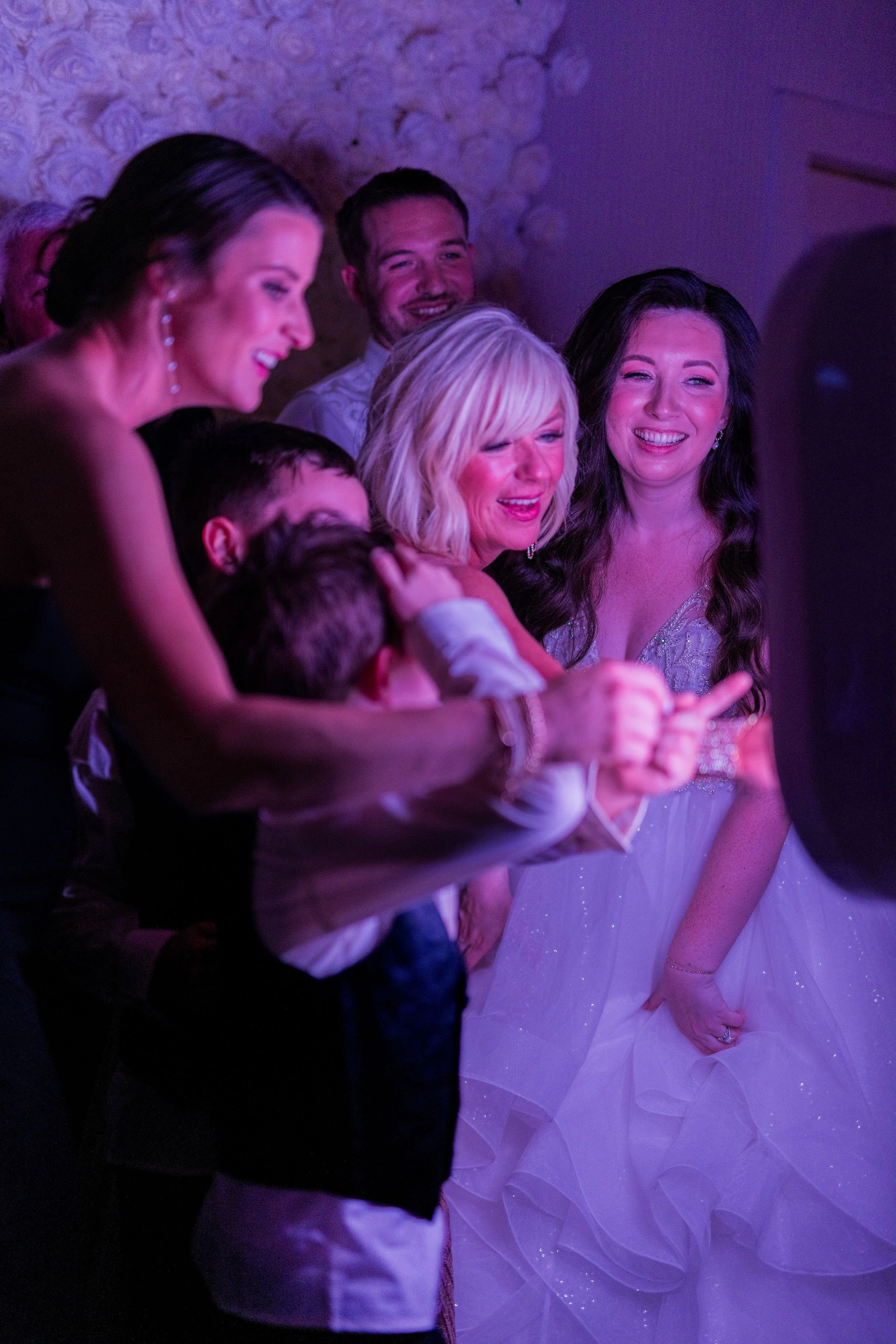 Guests laughing together while using the Modern Booth at a wedding reception, creating candid moments and instantly shareable digital photos