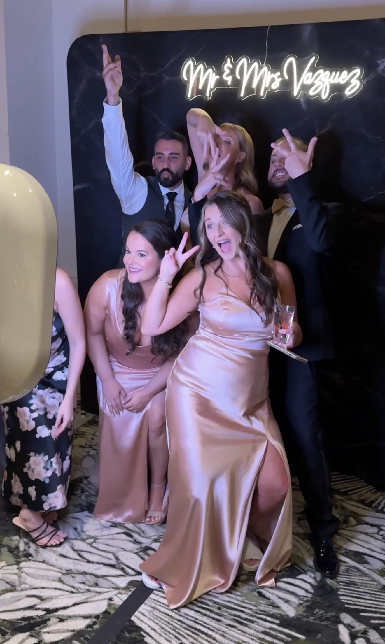 Friends enjoying the Modern Booth during a wedding reception, capturing photos, GIFs, and boomerangs throughout the evening