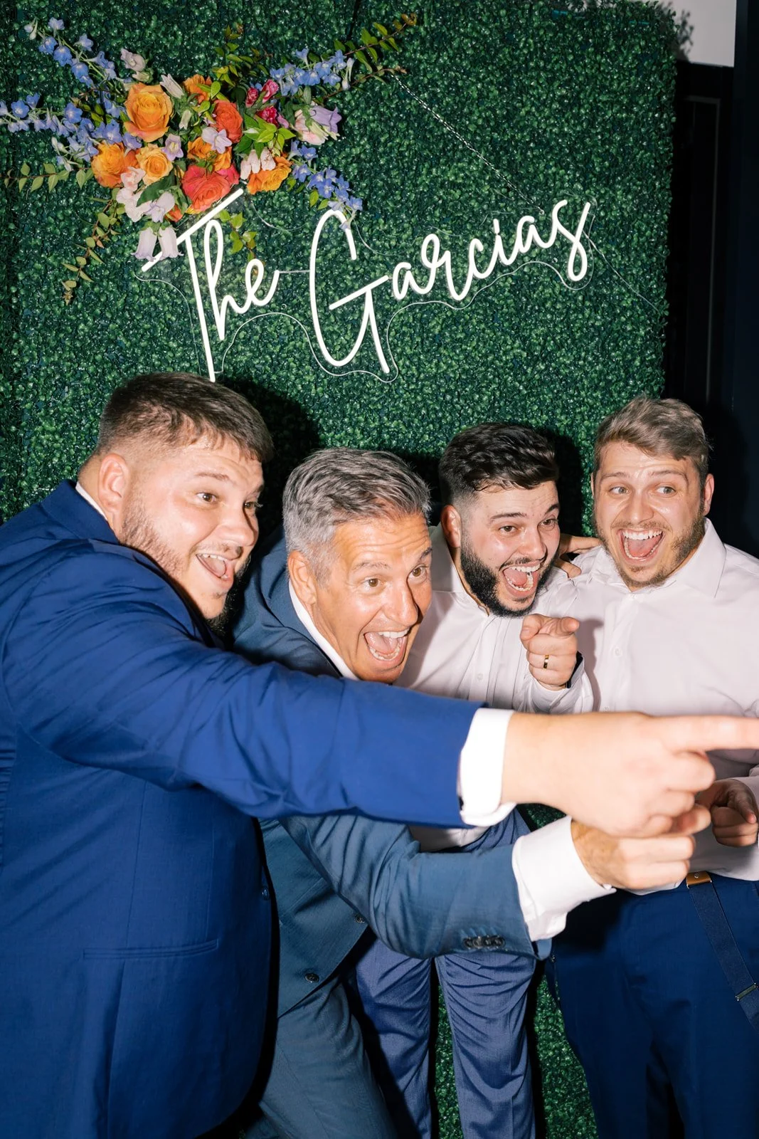 Guests laughing and posing for a photo booth picture during a Savannah wedding reception