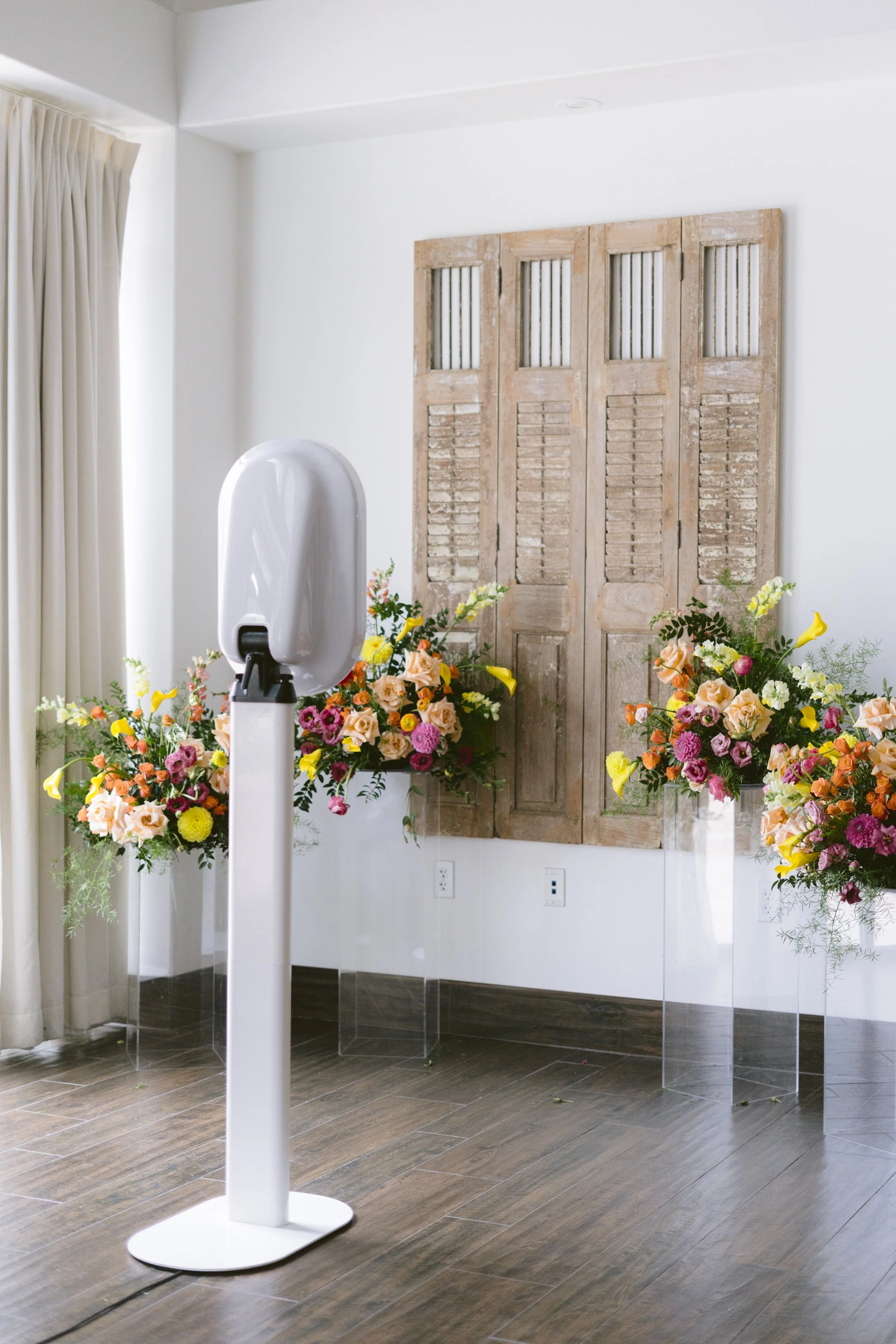 The Modern Booth set up for a Savannah wedding with elegant floral décor, providing a stylish digital photo booth experience for guests