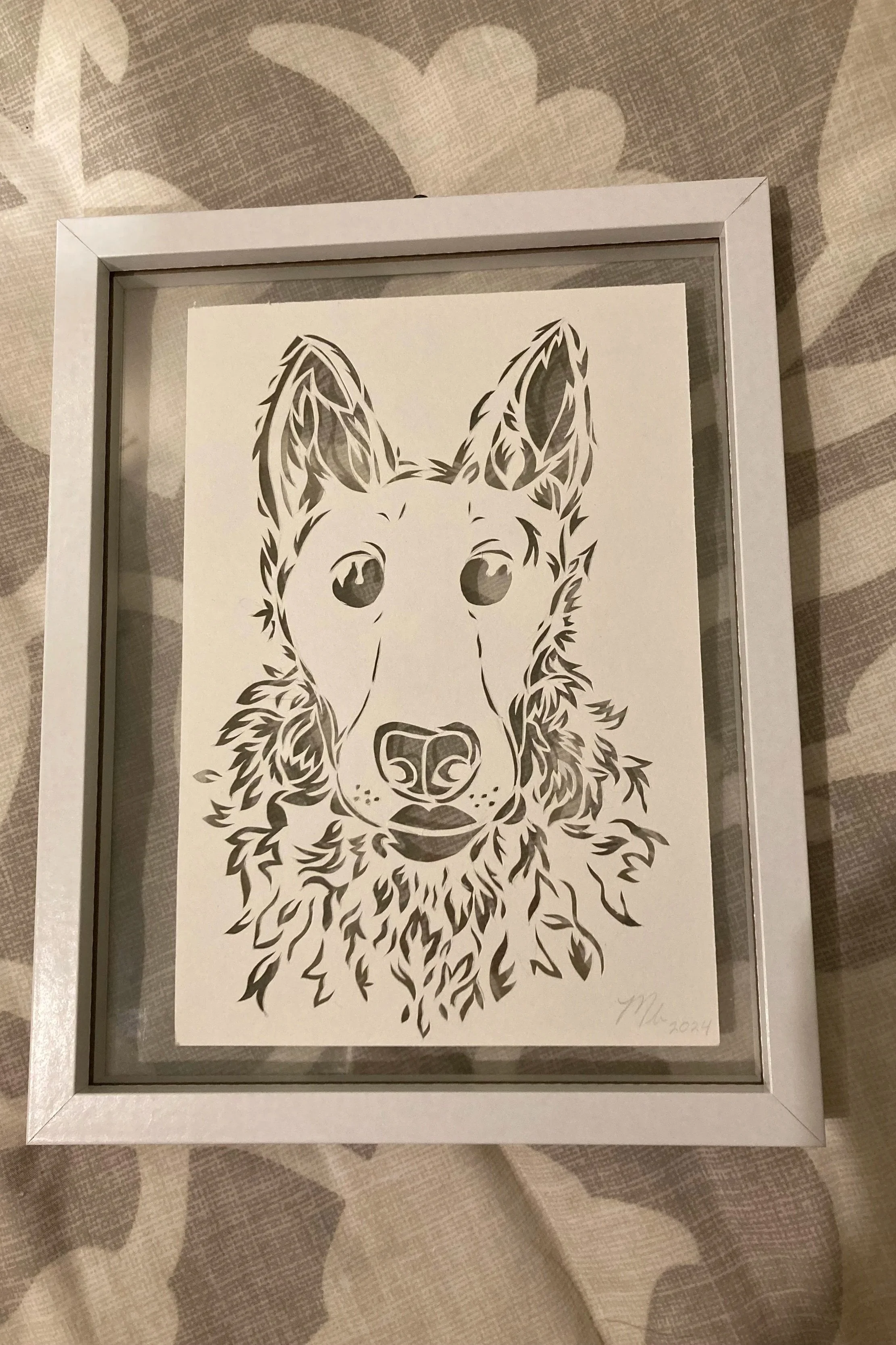 Black and white framed artwork of a husky's face with detailed line work.