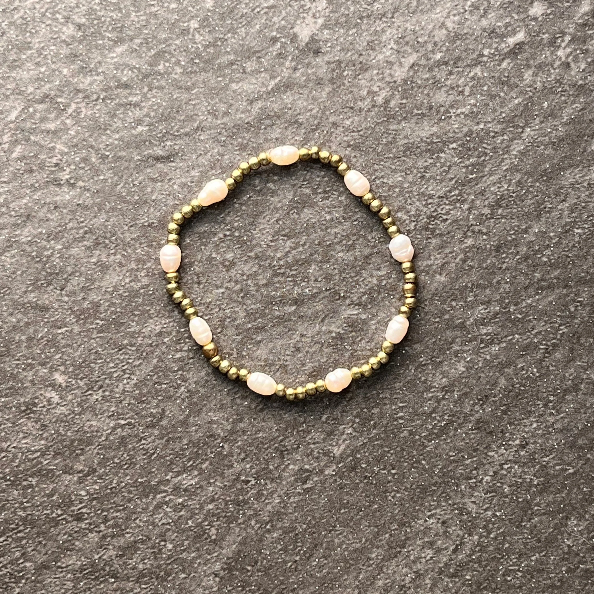 Gold Pearl: Tiny gold seed beads are paired with rice pearl accents for a bracelet that is effortlessly versatile. 

$20