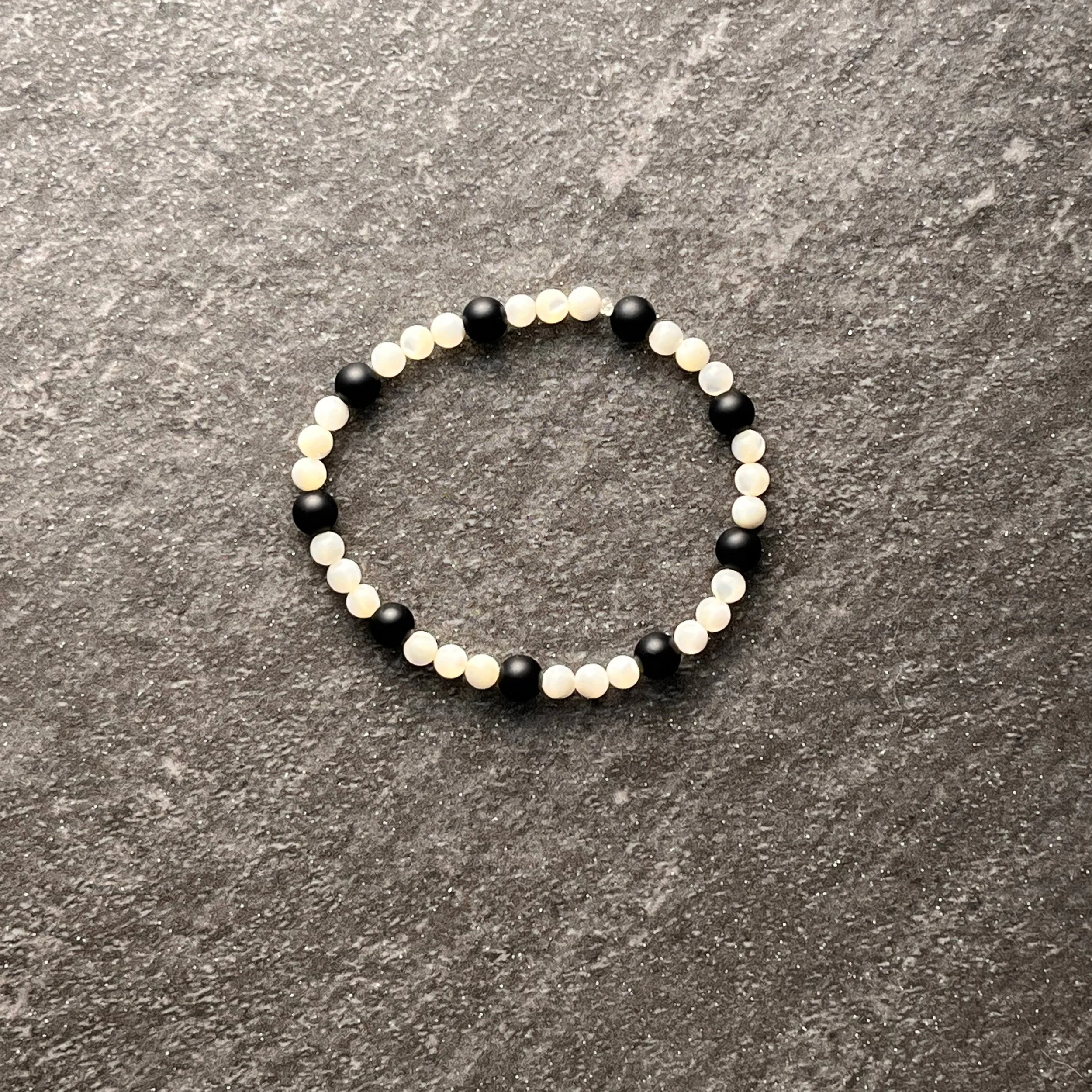 Ivory & Black: Mother of pearl beads paired with smooth matte glass beads for a simple and elegant look. 

$20 