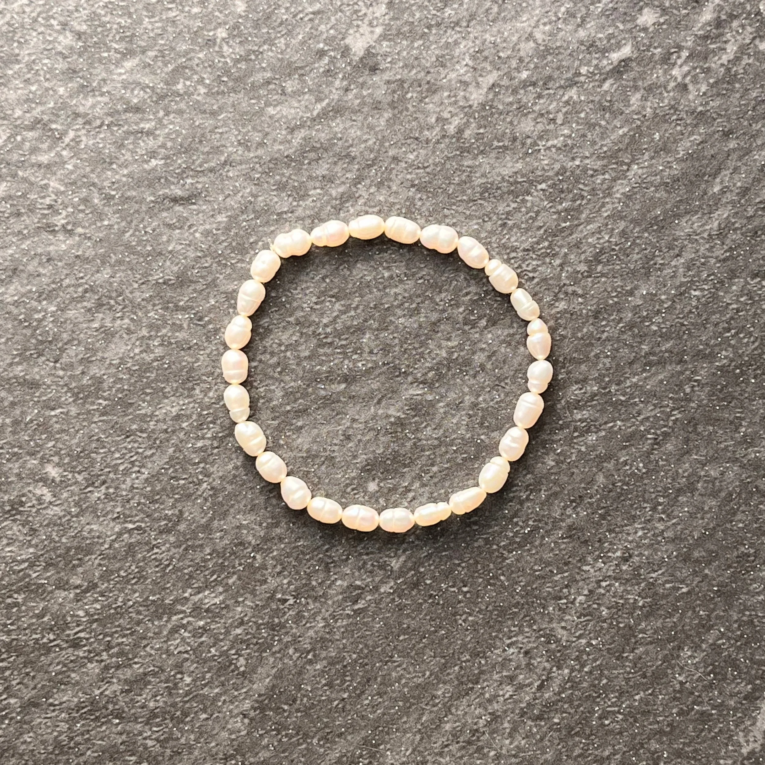 Timeless Pearl: Delicate rice pearls create a timeless bracelet that's perfect for layering. 

$20