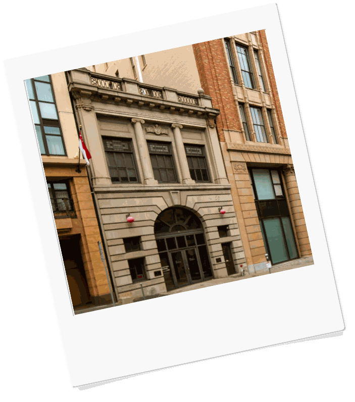 Street view of the Engine 2 firehouse at 460 Bush Street, between neighboring buildings