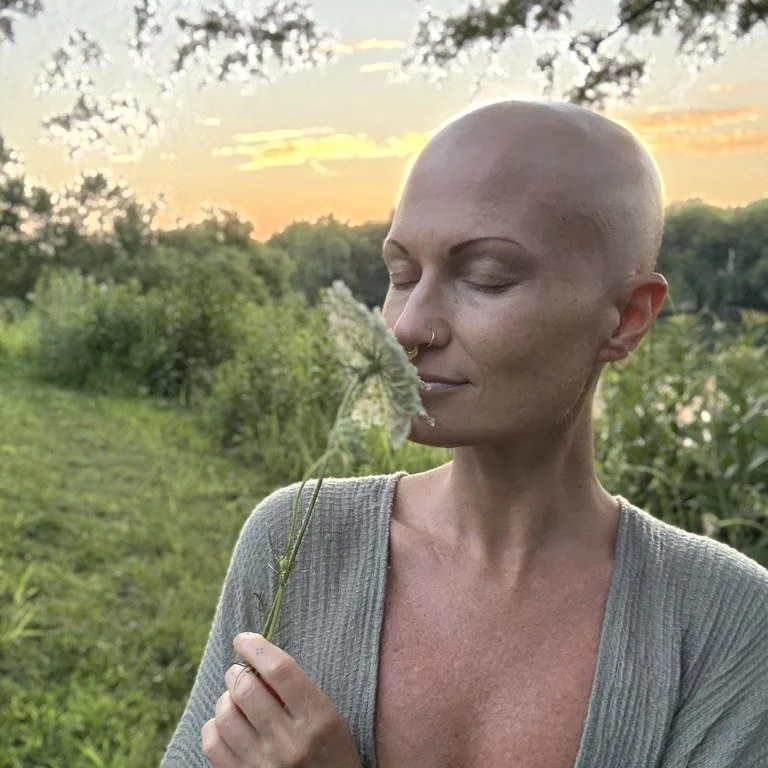 Elizabeth Anura in a field at sunset