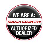 Black, red, and white circular badge with the text "WE ARE A: ROUGH COUNTRY AUTHORIZED DEALER".