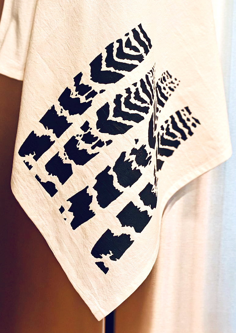 image of cotton tea towel with original Vriesea splendens Flaming Sword bromeliad leaves screen printed design from Handforth Botanical Studio