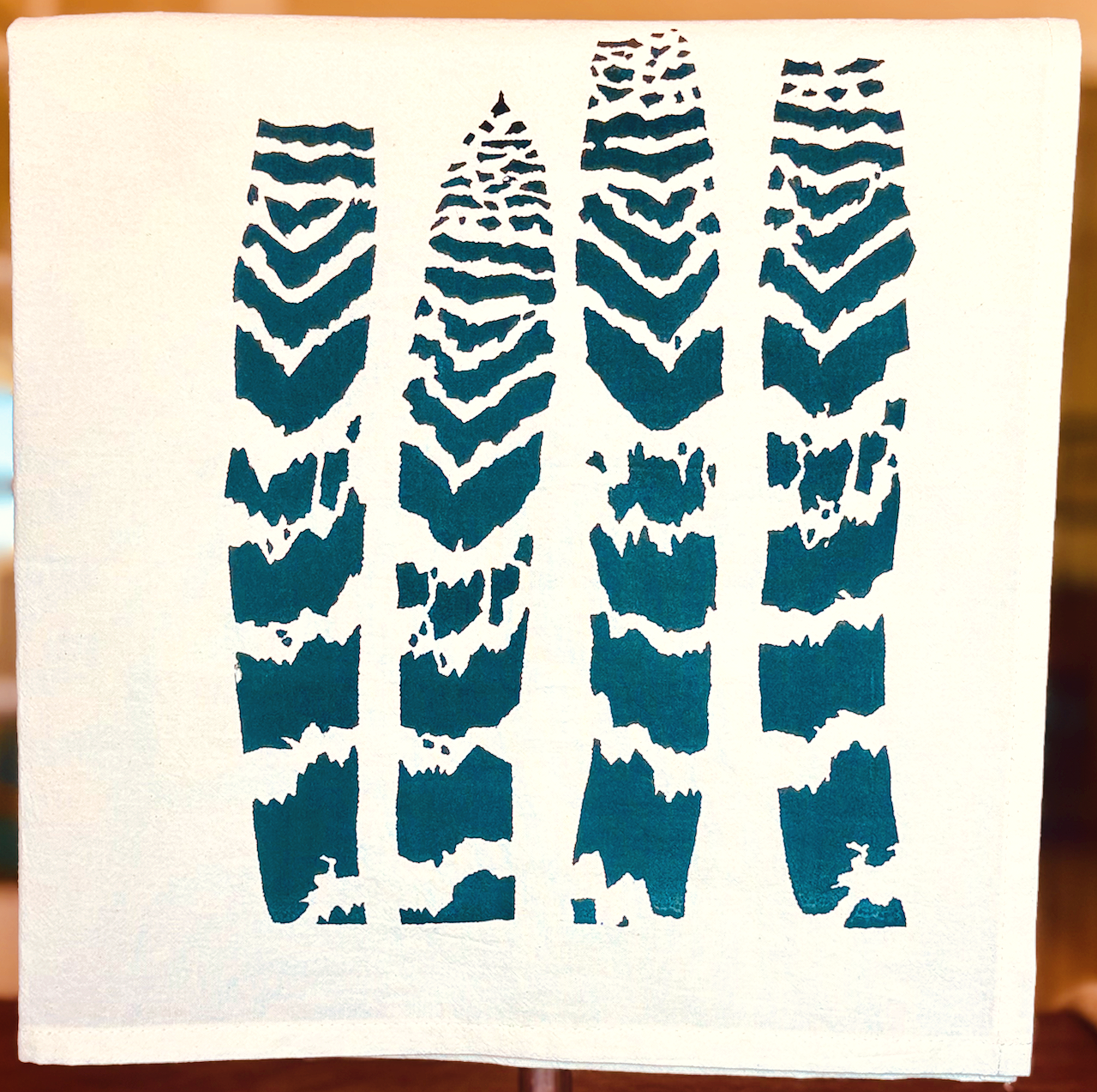 image of cotton tea towel with original Vriesea splendens Flaming Sword bromeliad leaves screen printed design from Handforth Botanical Studio