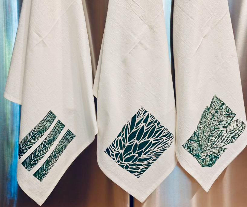 Cotton tea towels featuring three original designs from Handforth Botanical Studio