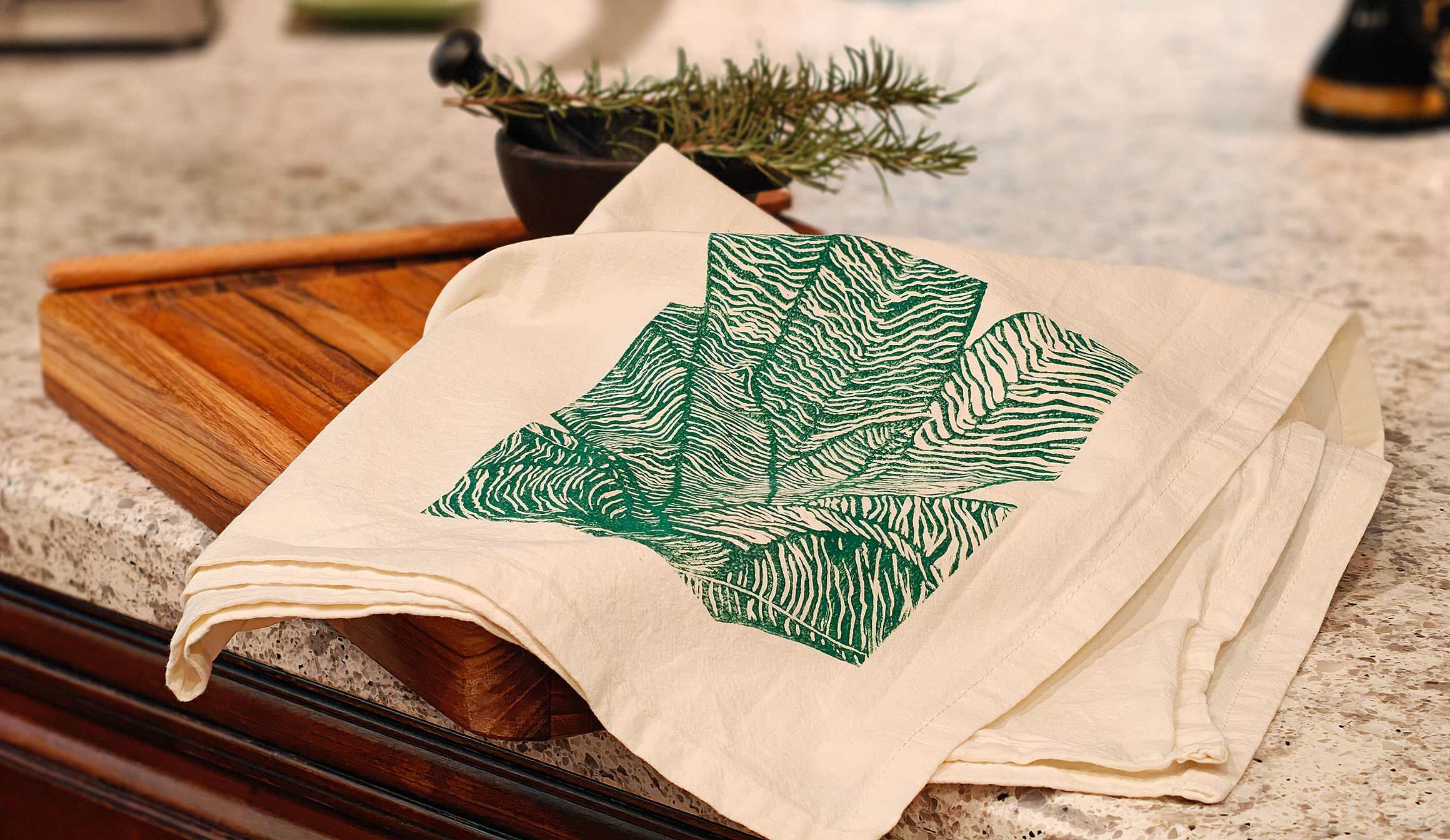 image of cotton tea towel with original Vriesea hybrid linocut design from Handforth Botanical Studio