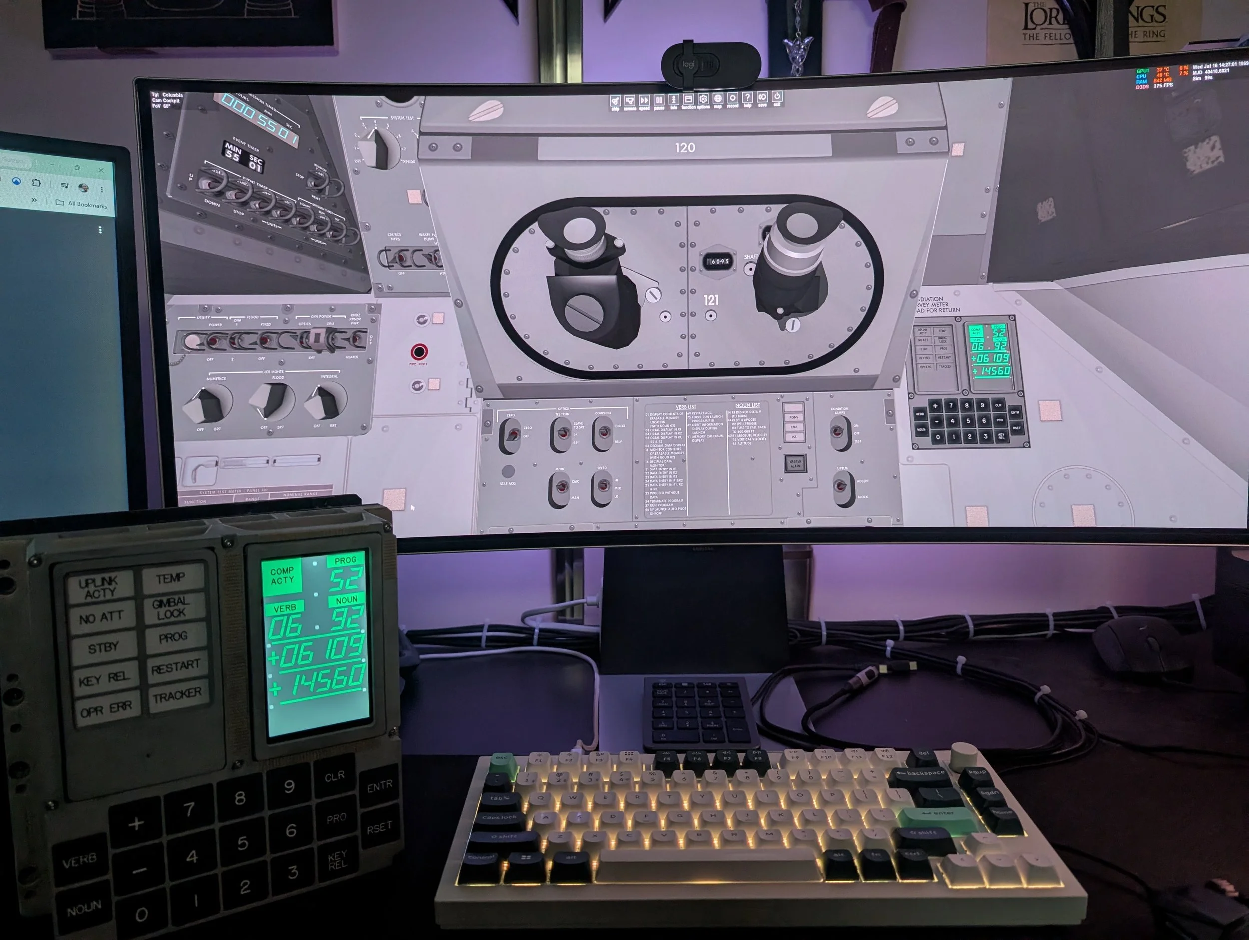 Inside a cockpit simulator with controls, screens, and medical monitors, featuring a large curved display and various control panels.