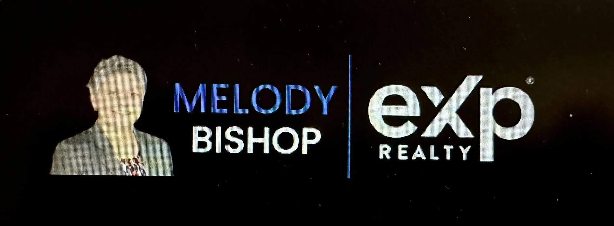 Photo of a woman with short blonde hair wearing a gray blazer, next to the logos for Melody Bishop and expo Realty.