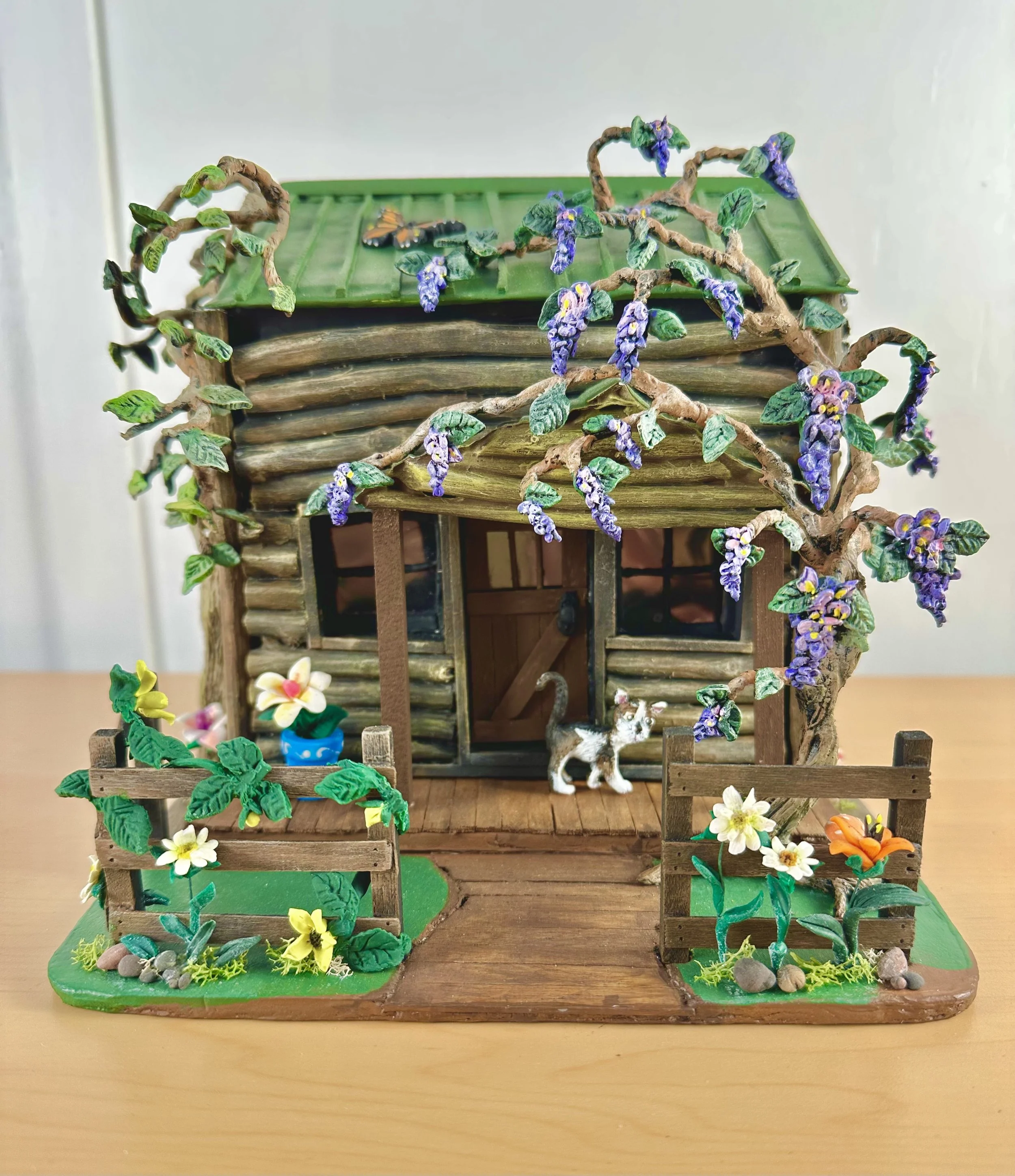Log Cabin with a Cat, Wisteria Tree, Flowers and a Fence