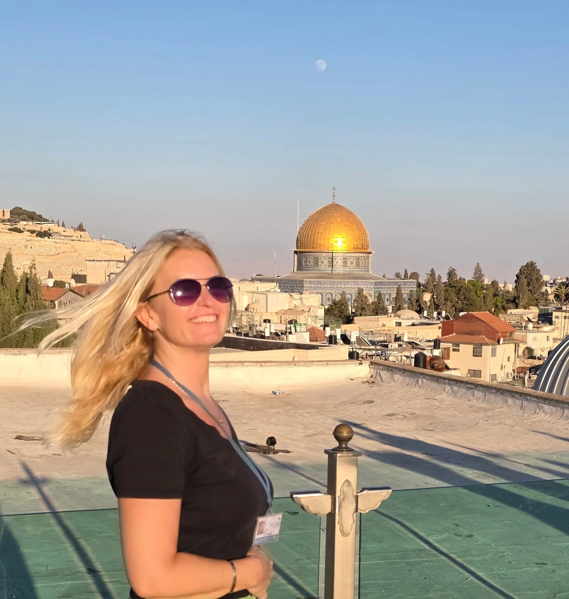 Alena Levy, licensed Holy Land guide and co-founder of Holyland Horizons, smiling outdoors at a scenic location in Jerusalem, Israel