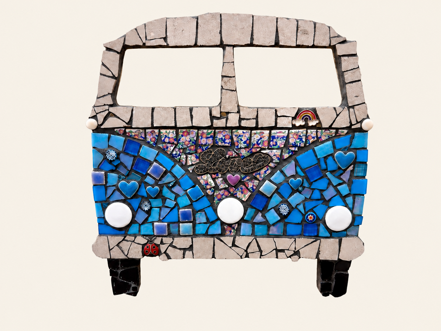 Mosaic art depicting a VW camper van, with blue and beige tiles, hearts, a rainbow, and the word "Love" in the center.
