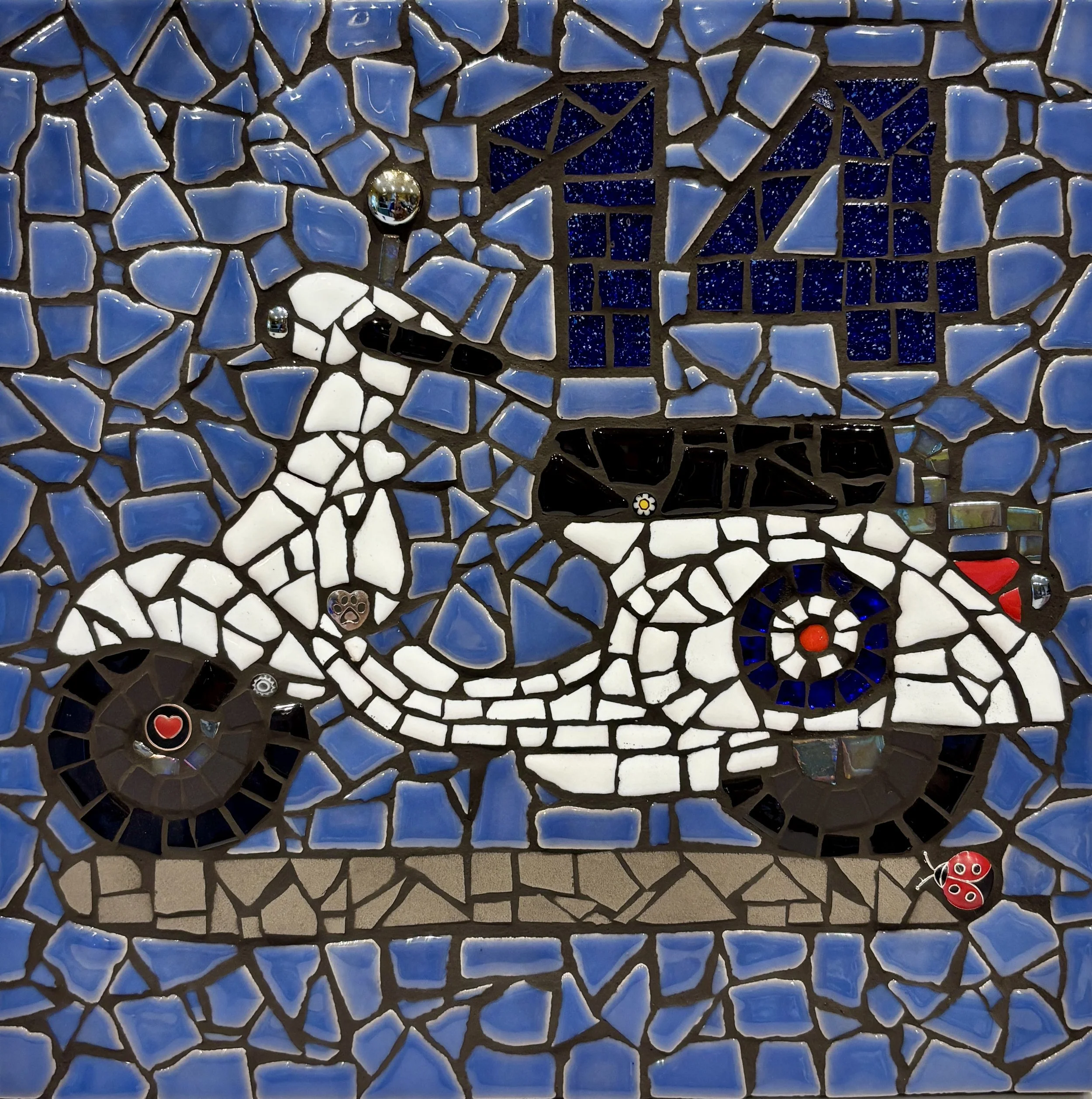 Mosaic house number with a white vespa