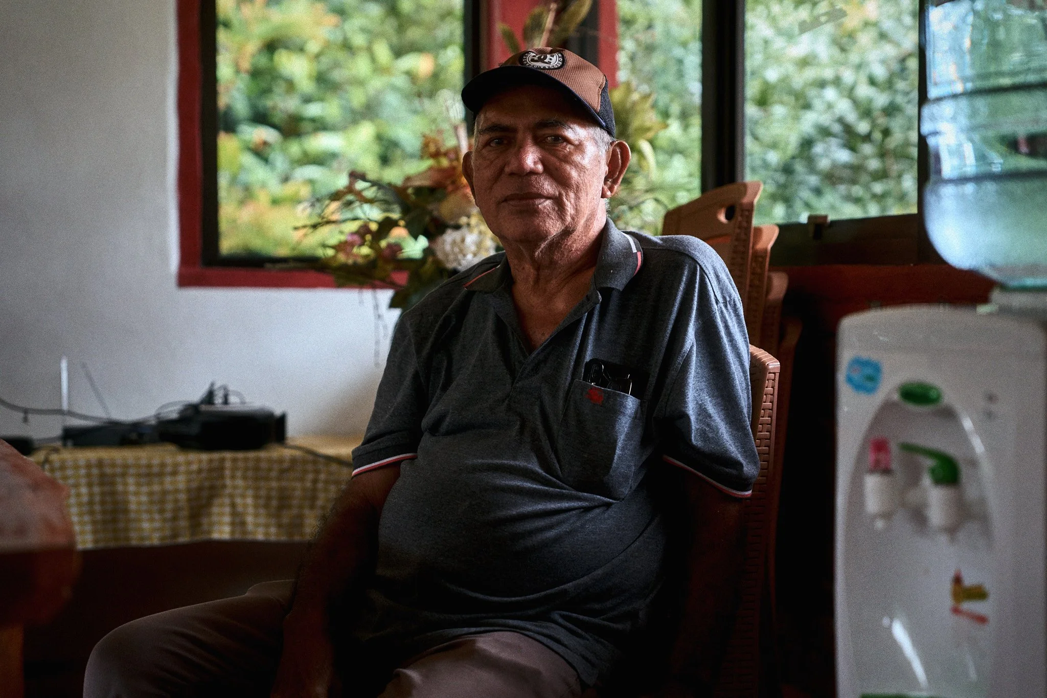 Portrait of a man sitting at his brother's place in Tomohon, Sulawesi.
