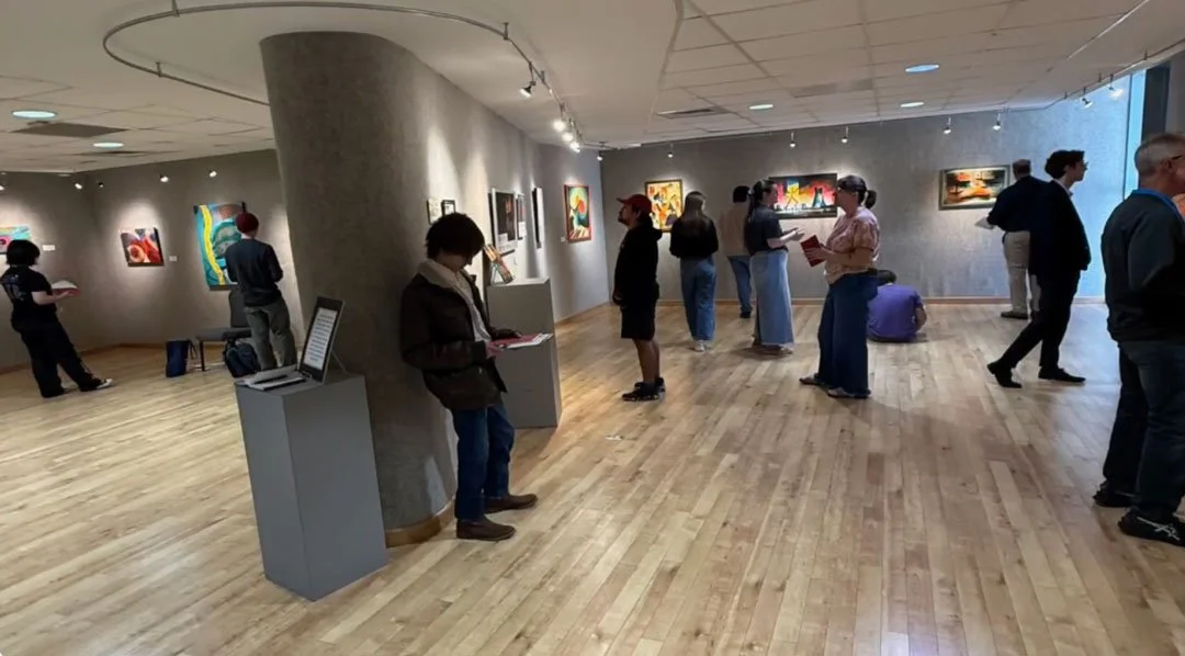 Visitors viewing Hank Hehmsoth’s Seeing Sound / Hearing Color exhibition at Brazosport College in 2026.