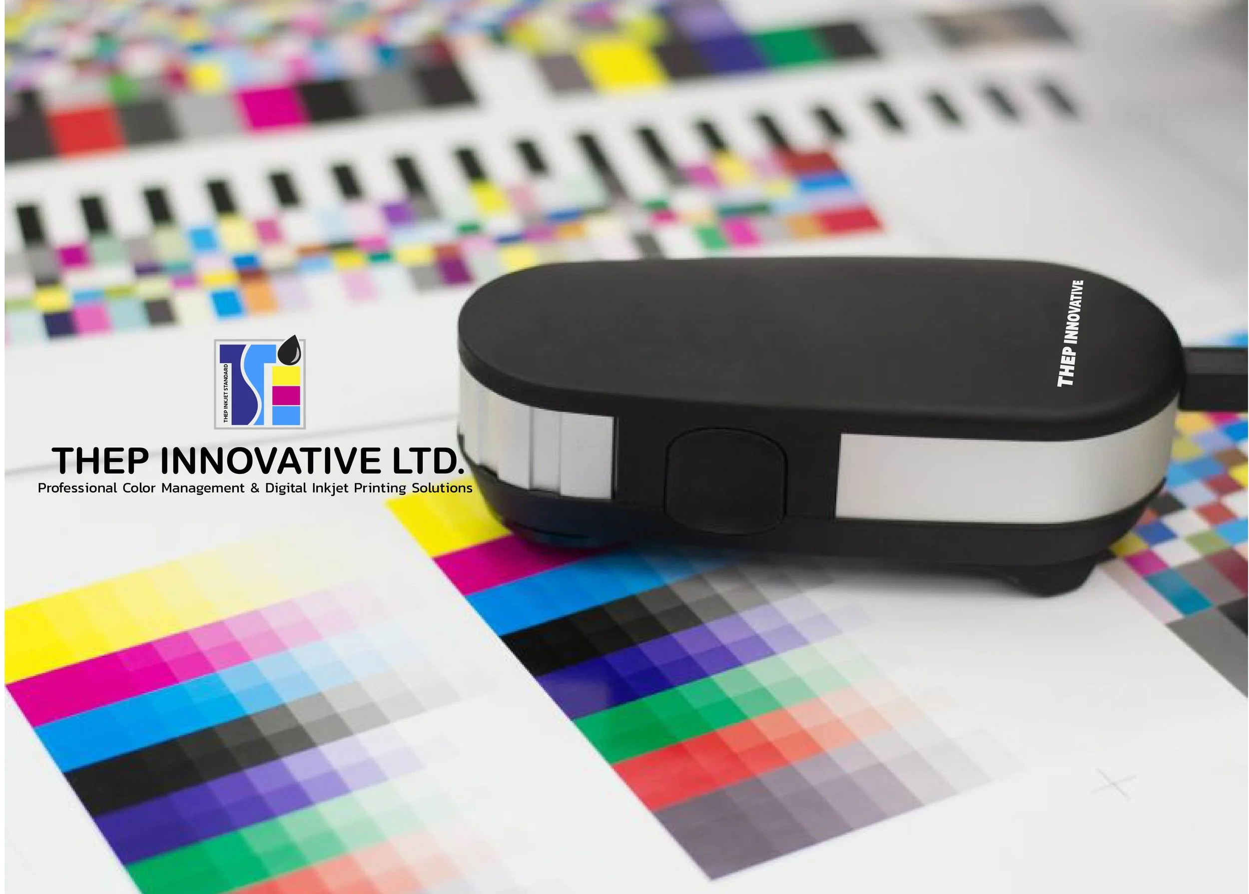 Color test chart with a black and silver device labeled 'THE P INNOVATIVE' resting on it, used for professional color management and digital inkjet printing solutions.