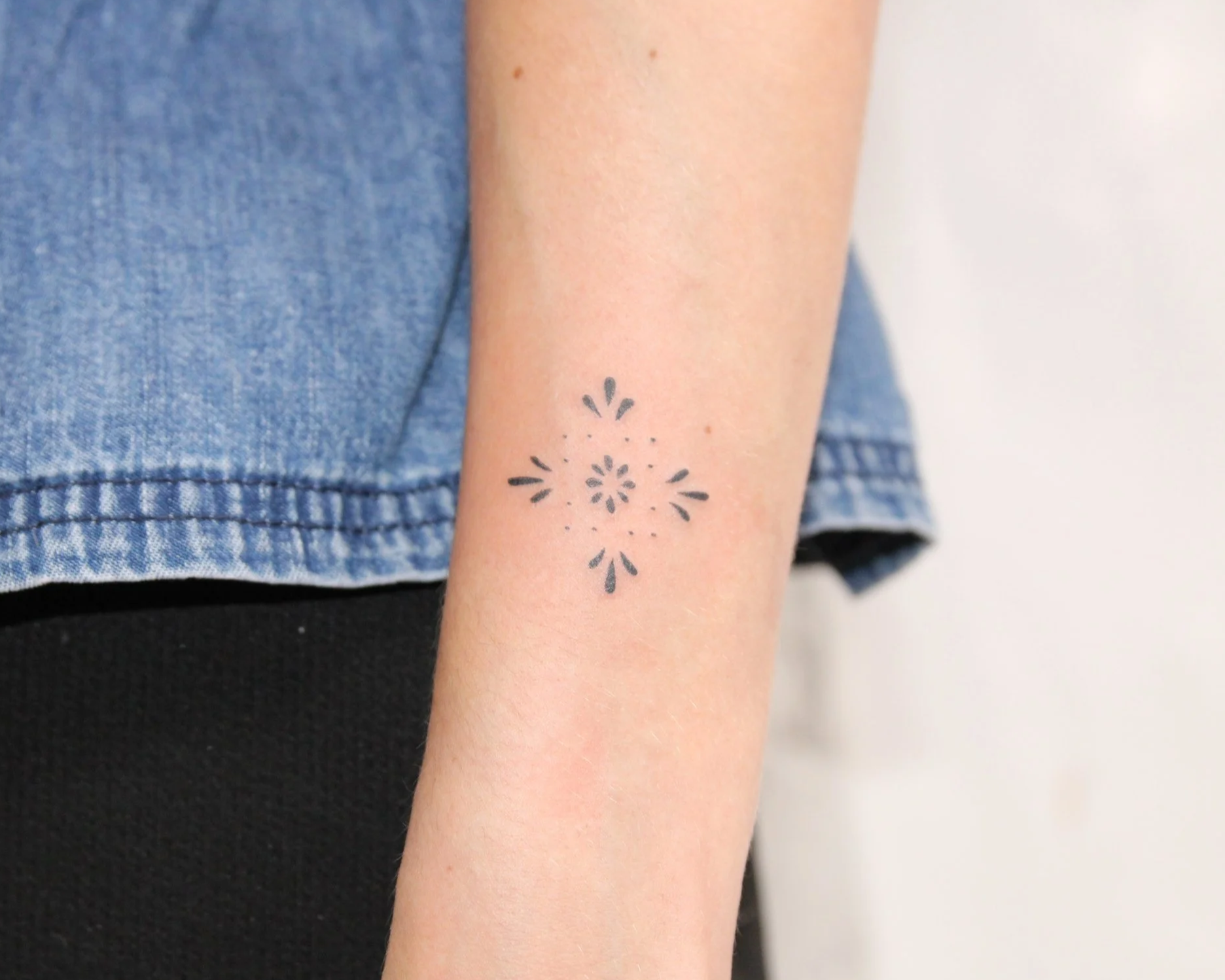 Fine line ornamental tattoo