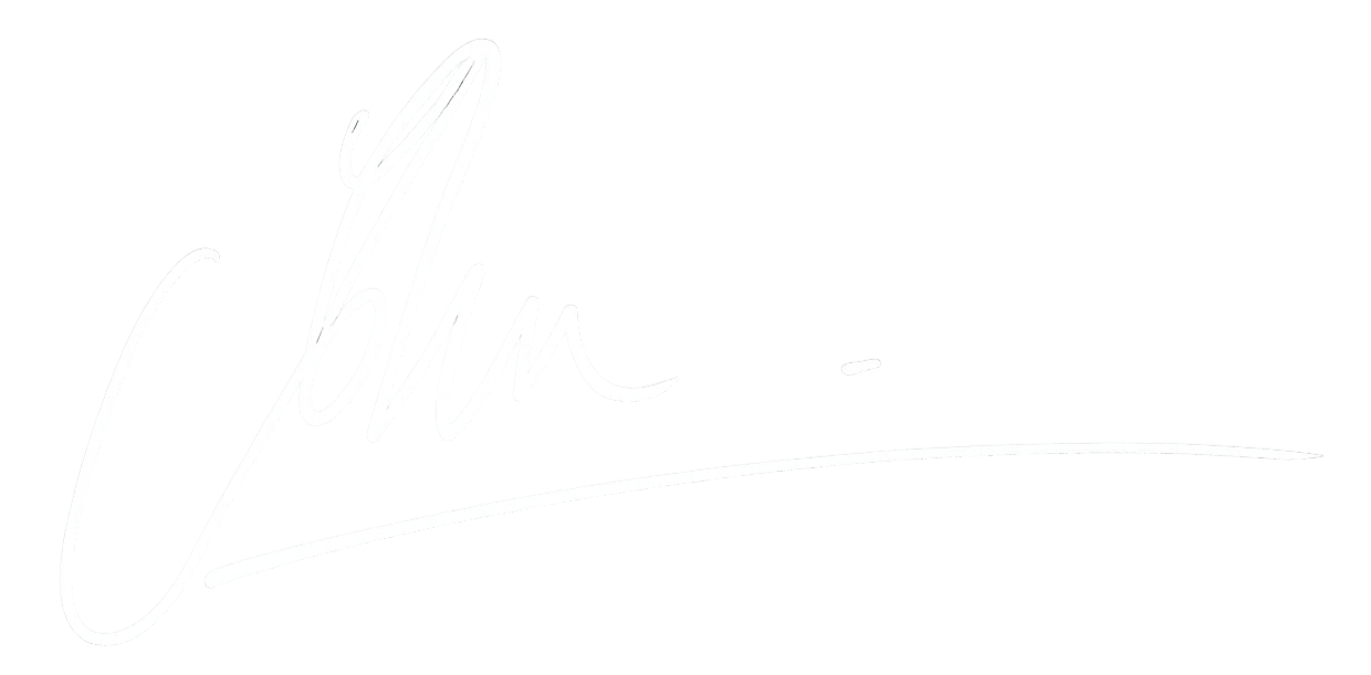 White signature on black background