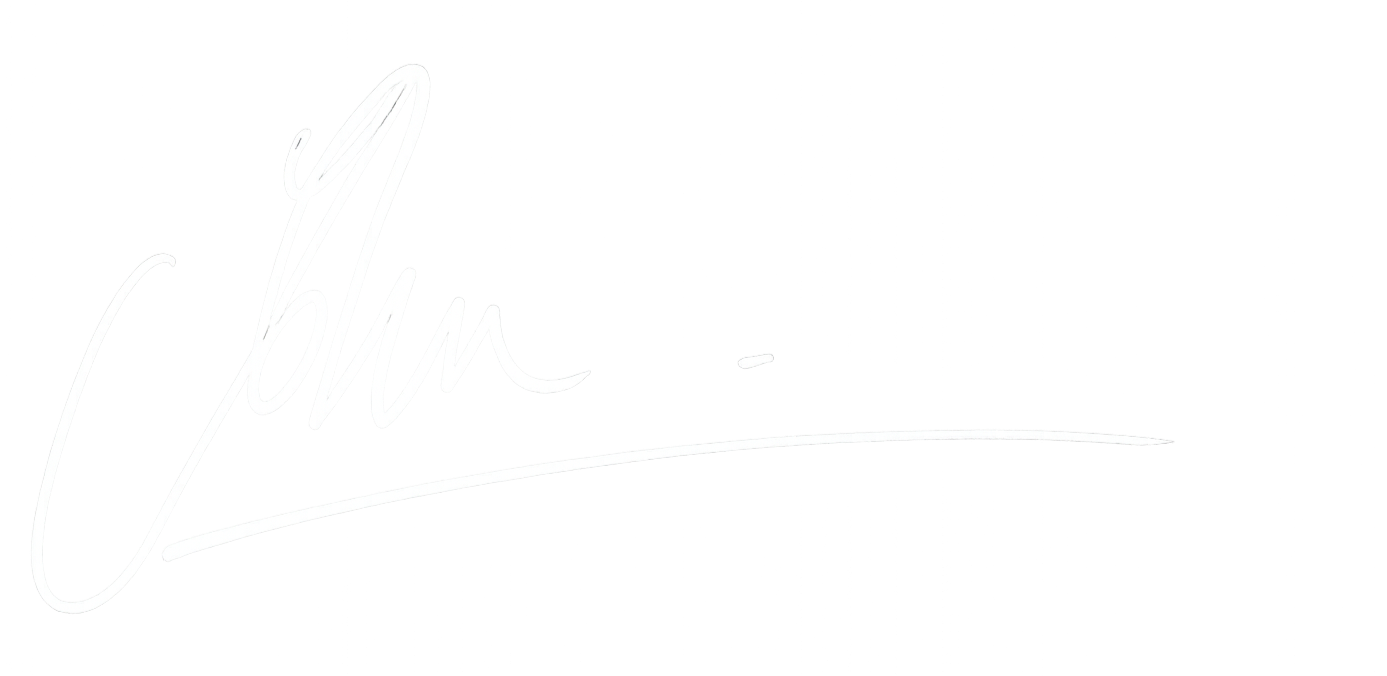 A white signature on a black background