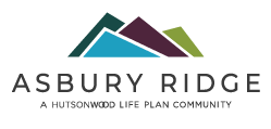 Logo of Asbury Ridge, a housing community, featuring stylized mountain peaks in blue, purple, and green with the text 'ASBURY RIDGE' and the slogan 'A HUTTONWOOD LIFE PLAN COMMUNITY'.