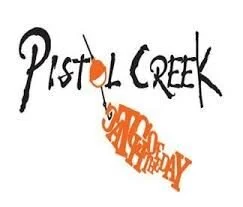 Text reading 'Pistal Creek' with an orange paint splatter and 'Happy Birthday' written in orange in a curved line.
