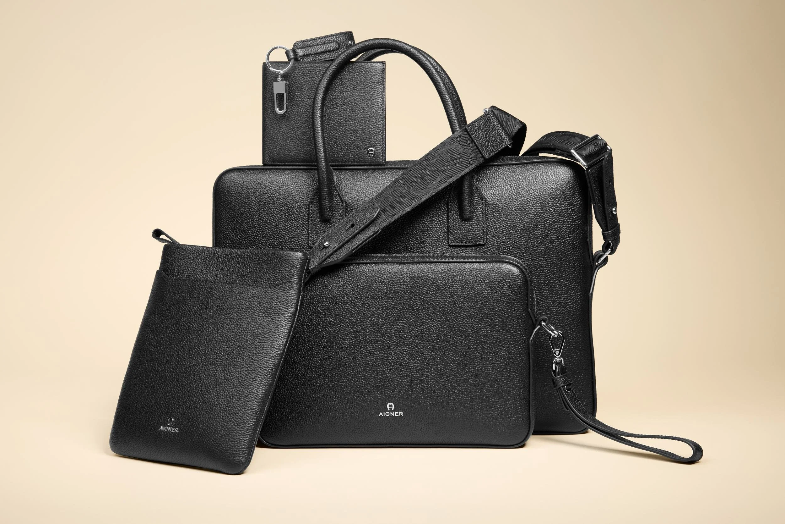 AIGNER Fall-Winter 2026: Herren-Lederwaren in Schwarz, Businesstasche und Portemonnaie