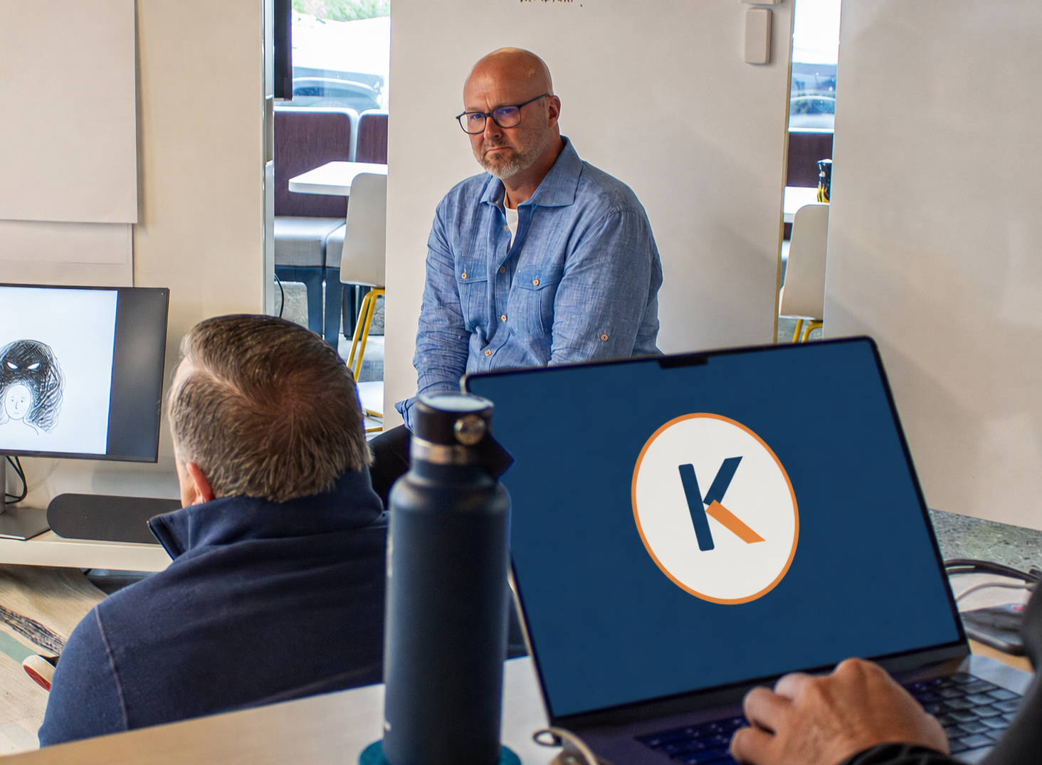 Bob Karel listening to participants during an executive strategy and leadership workshop.