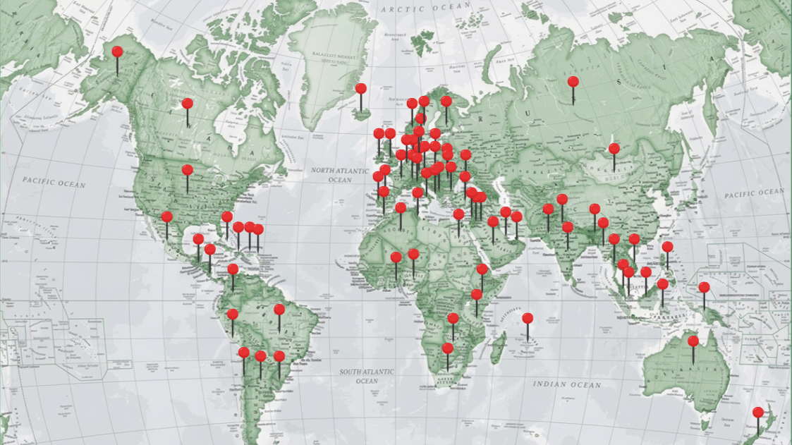 World map with red pins marking various locations around the globe.