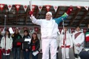 Communities show their pride as they greet the Olympic Torch Relay