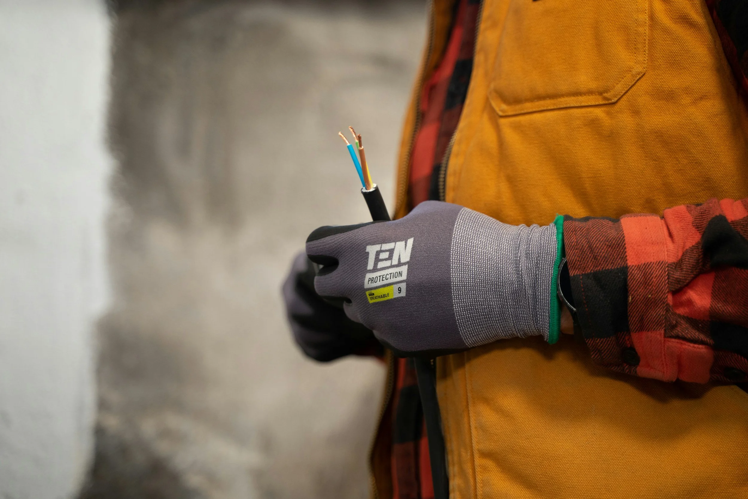 Commercial electrician preparing electrical wiring for installation.