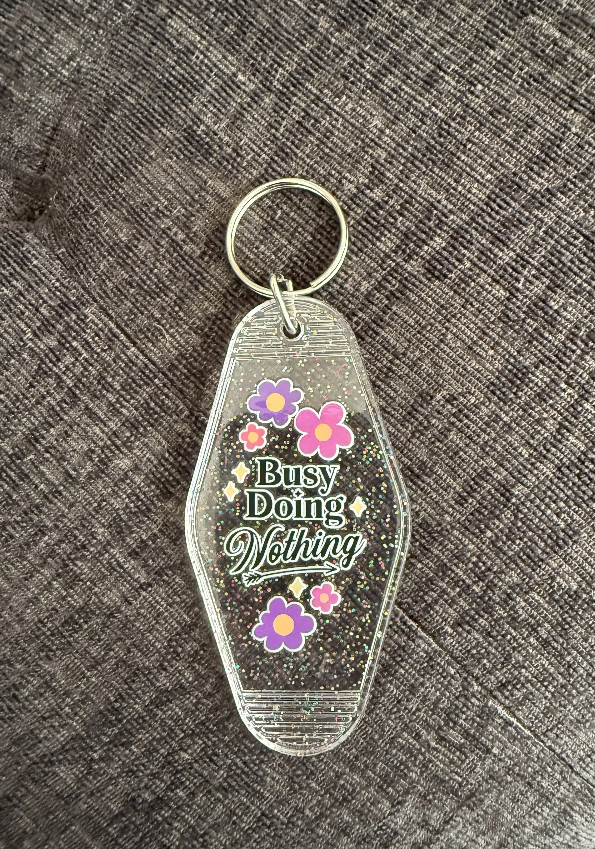 Playful 'Busy Doing Nothing' Keychain