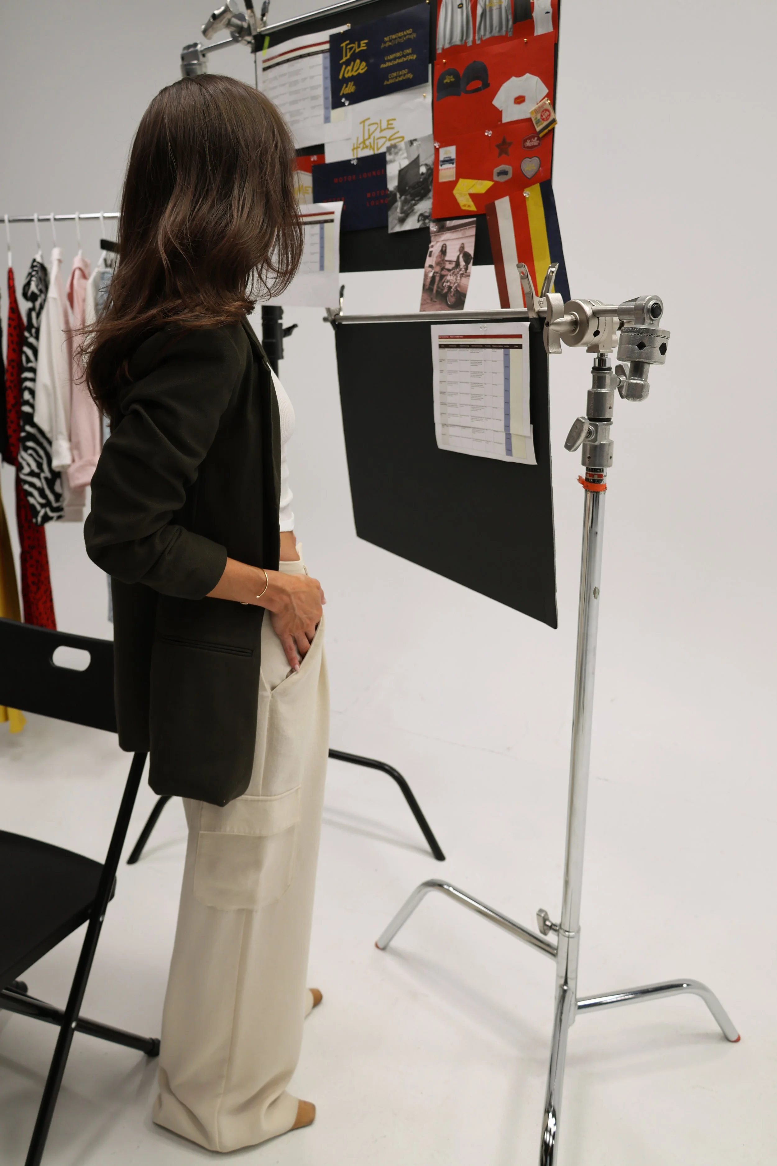 Nikole Réaux, founder and creative director of Kolt Following, reviewing mood board references as creative director of brand shoot