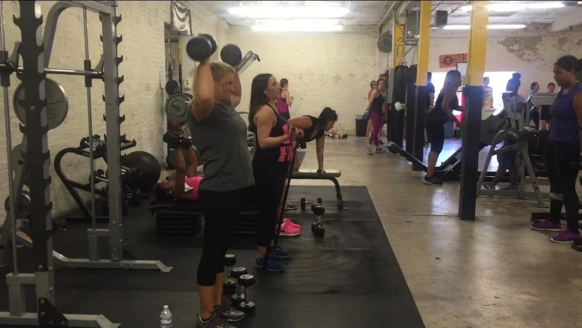Women participating in a coached strength training workout at Body By U Fit, building strength, confidence, and healthy habits in Central Houston.