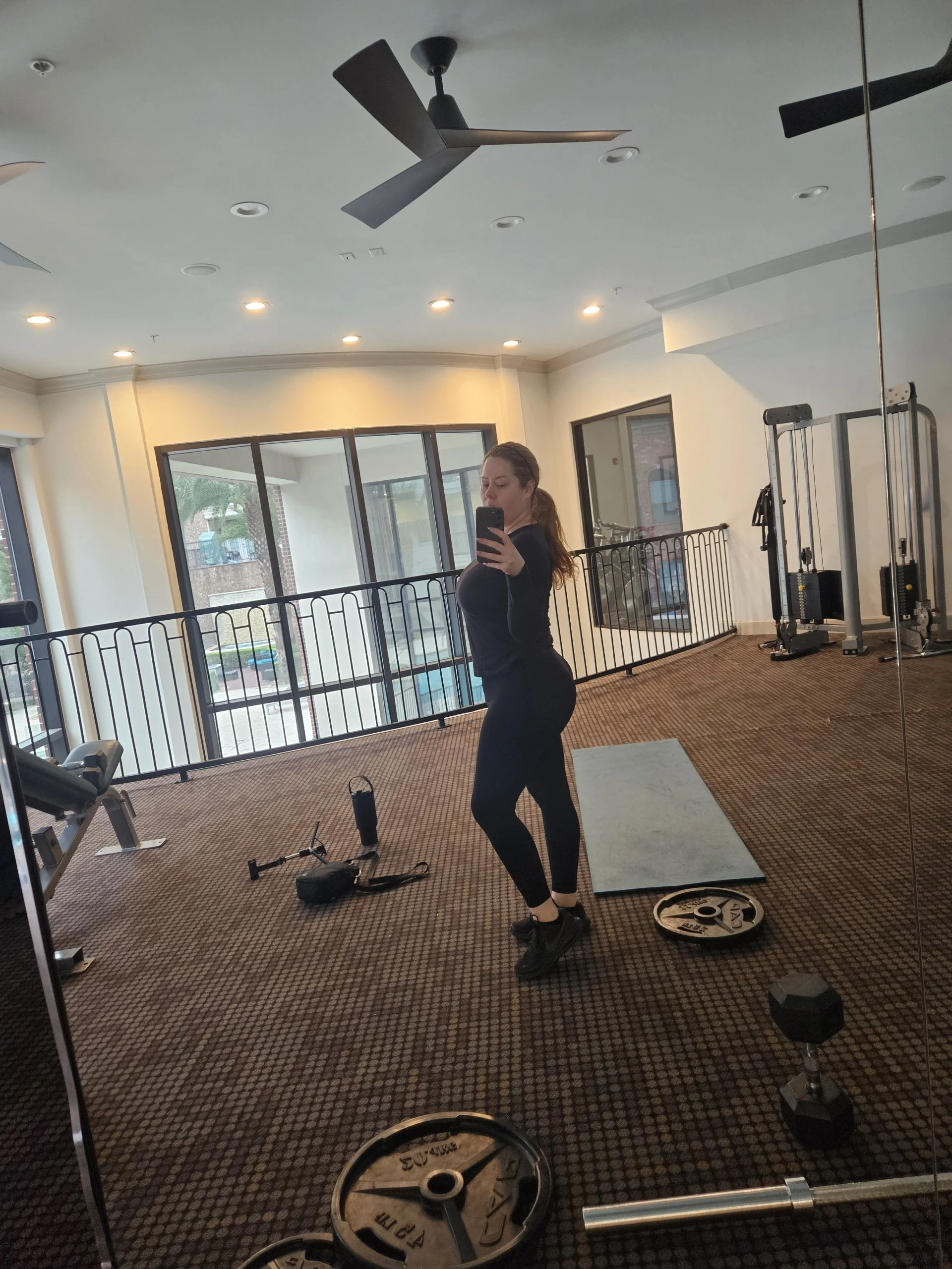 Woman participating in live virtual strength training with Coach Phil through Body By U Fit Fit4Her Anywhere.