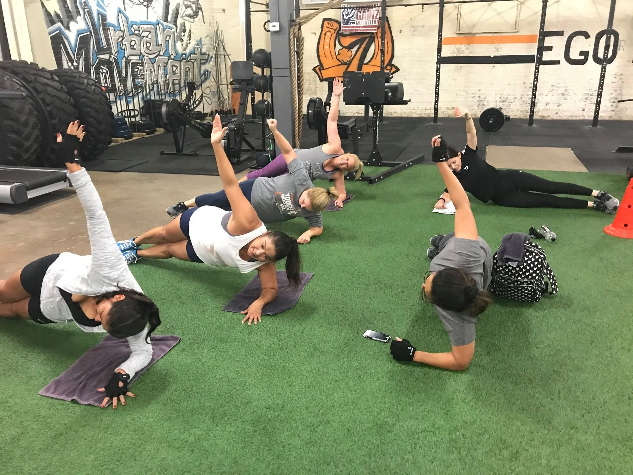 Women performing coached strength exercises with Body By U Fit in Houston, TX.