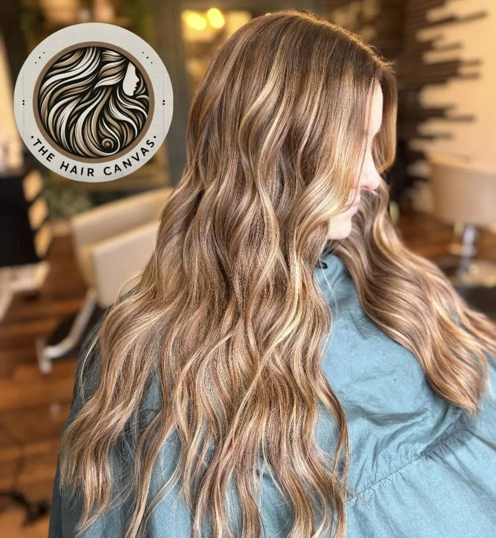 Warm dimensional hair color with face-framing highlights at The Hair Canvas in Ashland, KY.