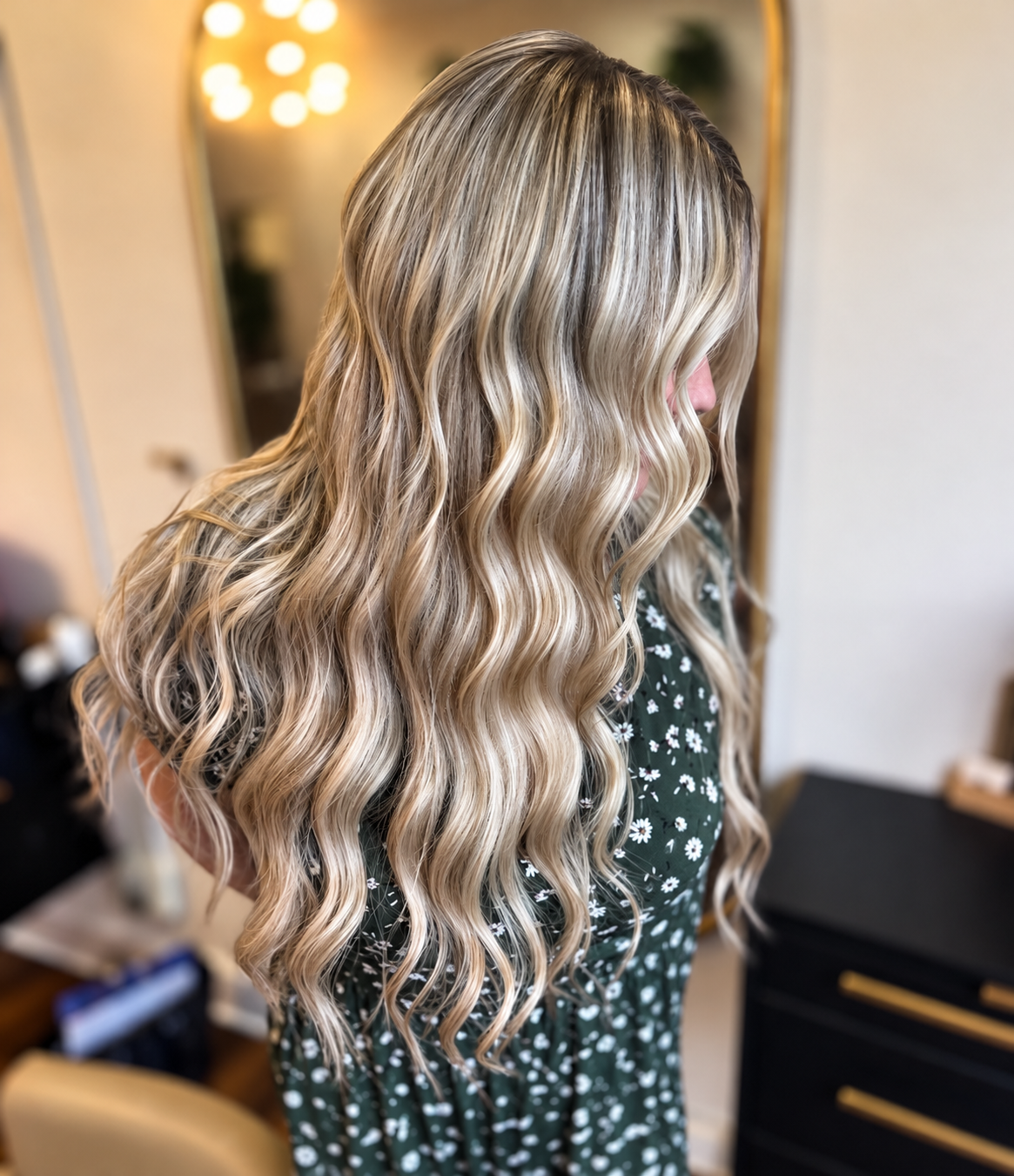 Long, flowing blonde waves showcasing beautiful length and dimension at The Hair Canvas in Ashland, Kentucky