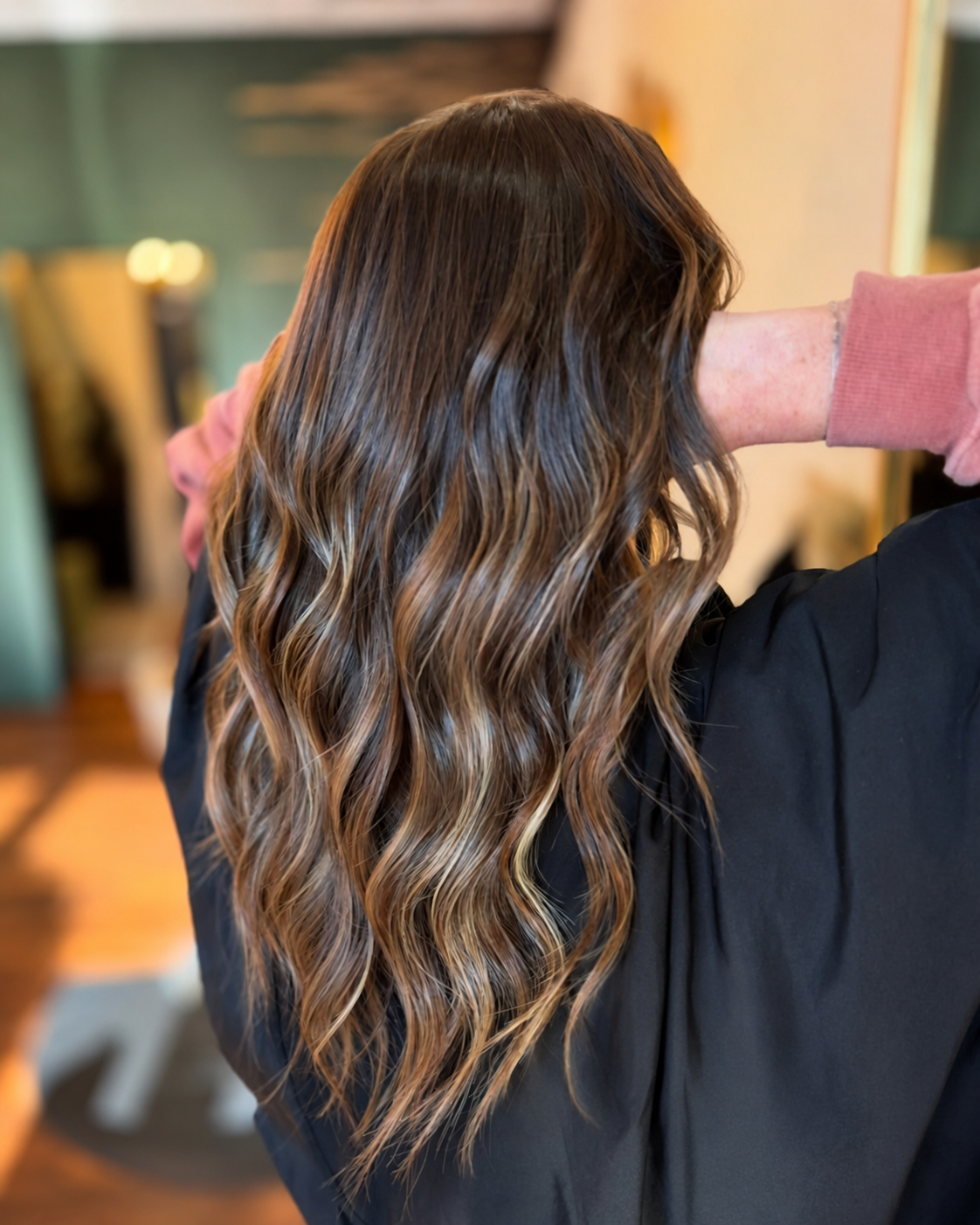 Dimensional brunette highlights with soft waves at The Hair Canvas in Ashland, KY.